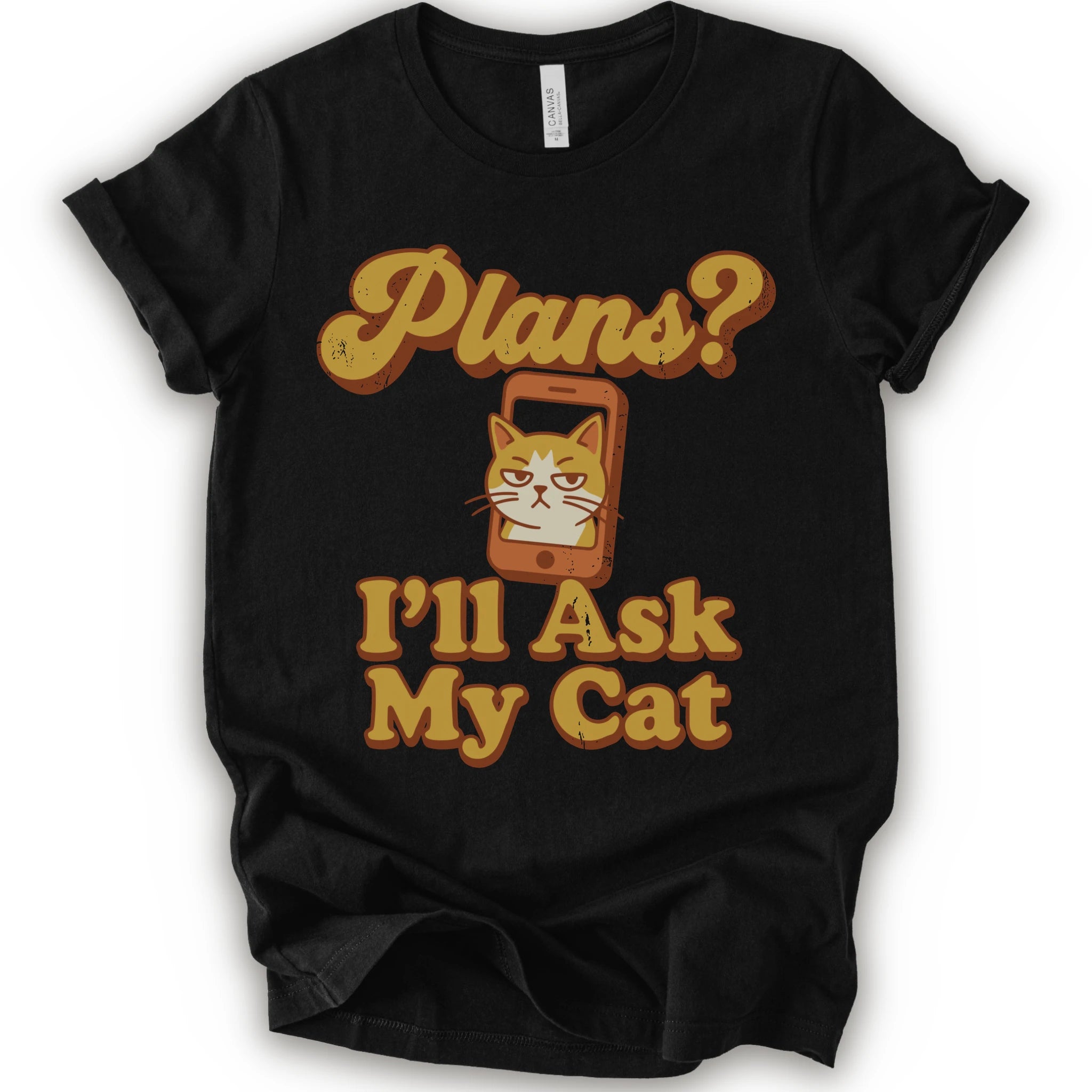 A black crewneck t-shirt with a graphic print that reads 'Plans? I'll Ask My Cat' in a retro yellow-orange font, featuring a grumpy orange tabby cat cartoon inside a smartphone.
