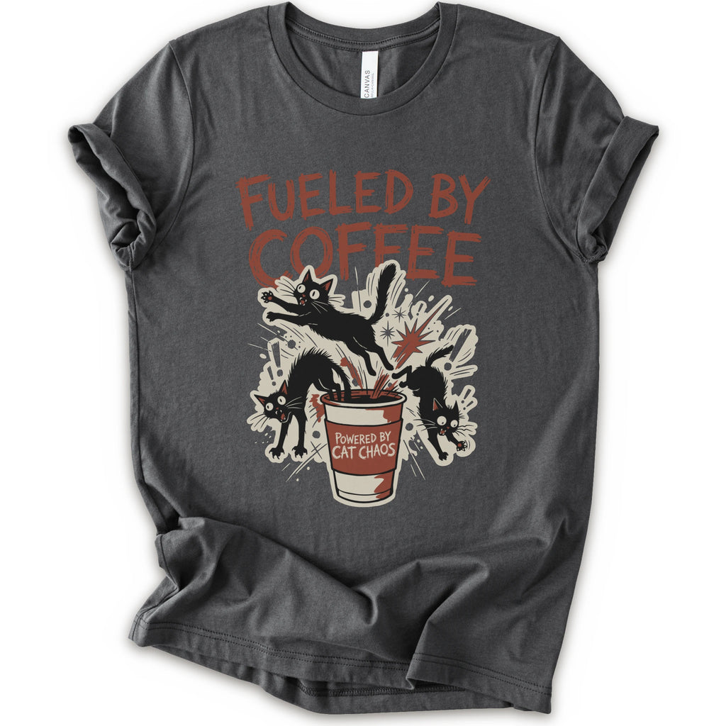 A asphalt short-sleeve graphic t-shirt laid flat on a white background. The shirt features a distressed graphic print with the text 'FUELED BY COFFEE' in a reddish-brown color, above an illustration of black cats emerging from a coffee cup labeled 'POWERED BY CAT CHAOS'.