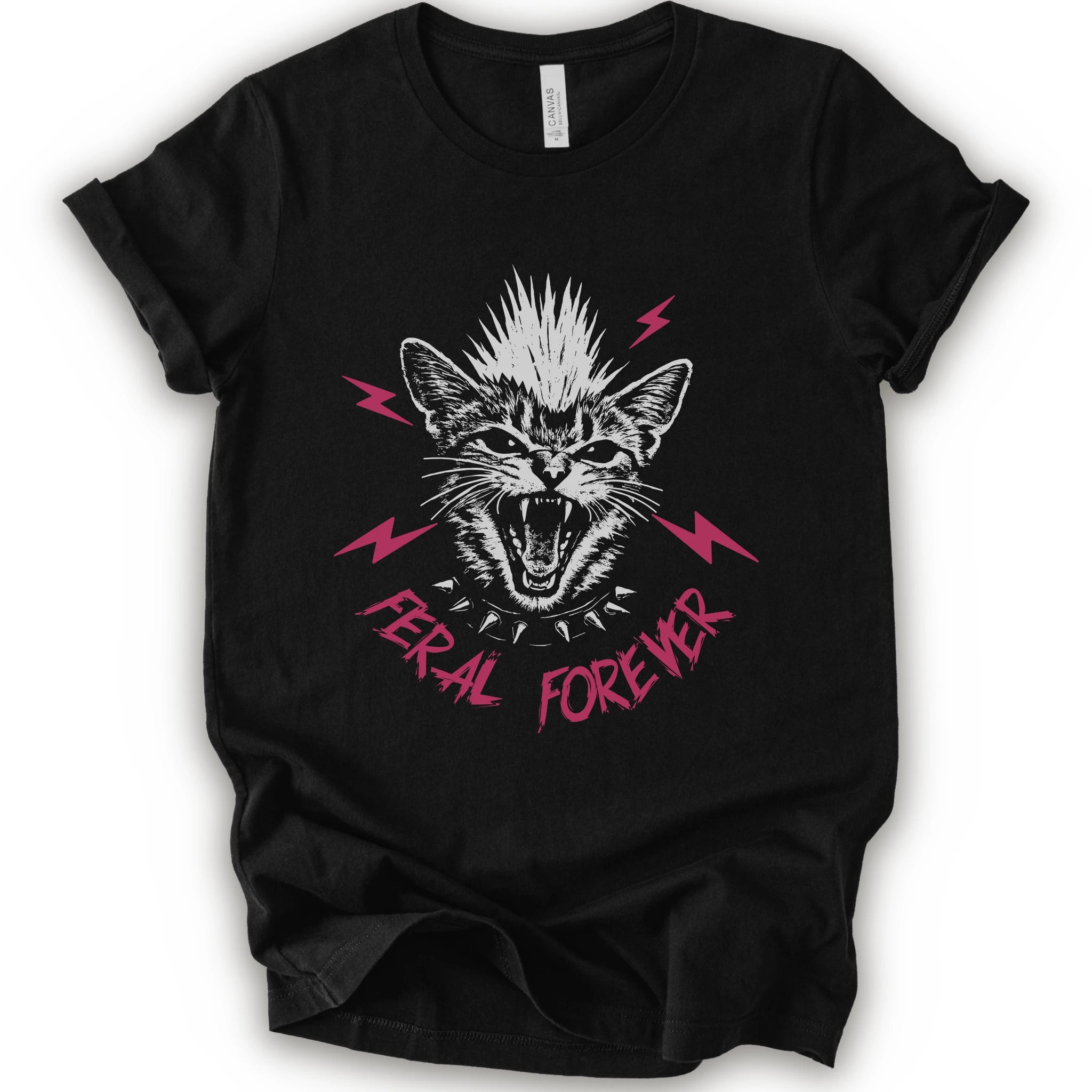 A black short-sleeve t-shirt with a graphic of a snarling cat with a mohawk, pink lightning bolts, and the text 'FERAL FOREVER' in pink.