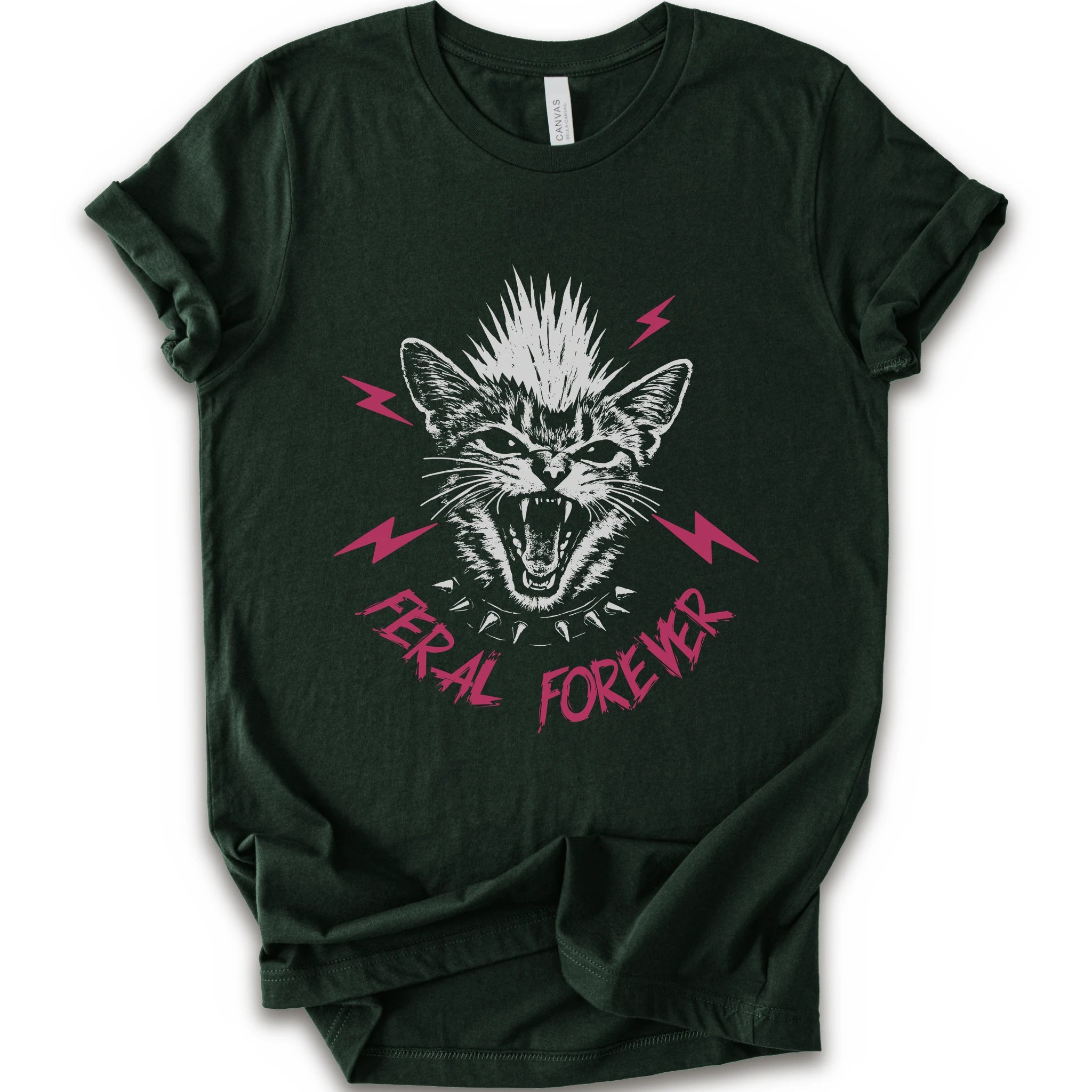 A natural short-sleeve t-shirt with a graphic of a snarling cat with a mohawk, pink lightning bolts, and the text 'FERAL FOREVER' in pink.