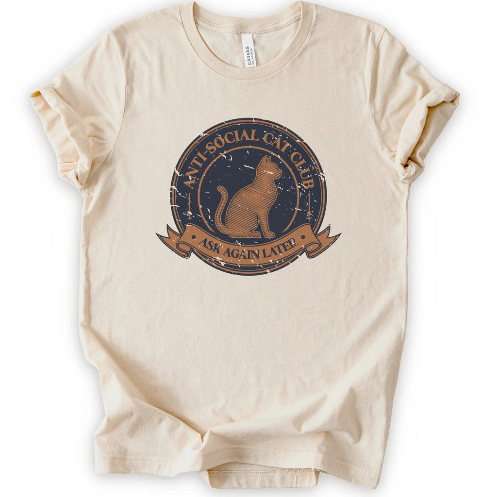 A natural crewneck t-shirt with a distressed graphic of a cat inside a circular seal that reads 'ANTI-SOCIAL CAT CLUB' and 'ASK AGAIN LATER'.