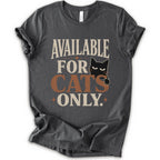 A asphalt short-sleeve t-shirt with a distressed graphic that reads 'AVAILABLE FOR CATS ONLY.' in beige and brown-orange lettering, featuring a black cat illustration.