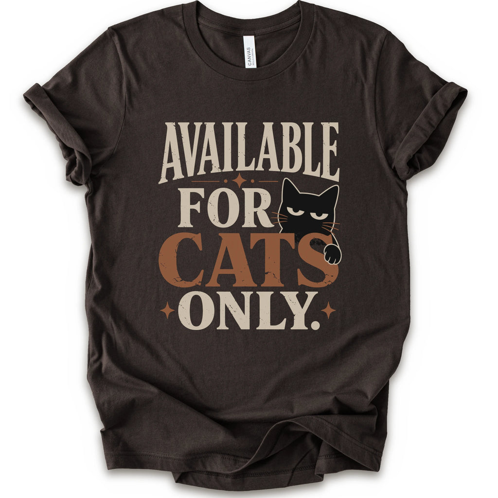 A brown short-sleeve t-shirt with a distressed graphic that reads 'AVAILABLE FOR CATS ONLY.' in beige and brown-orange lettering, featuring a black cat illustration.