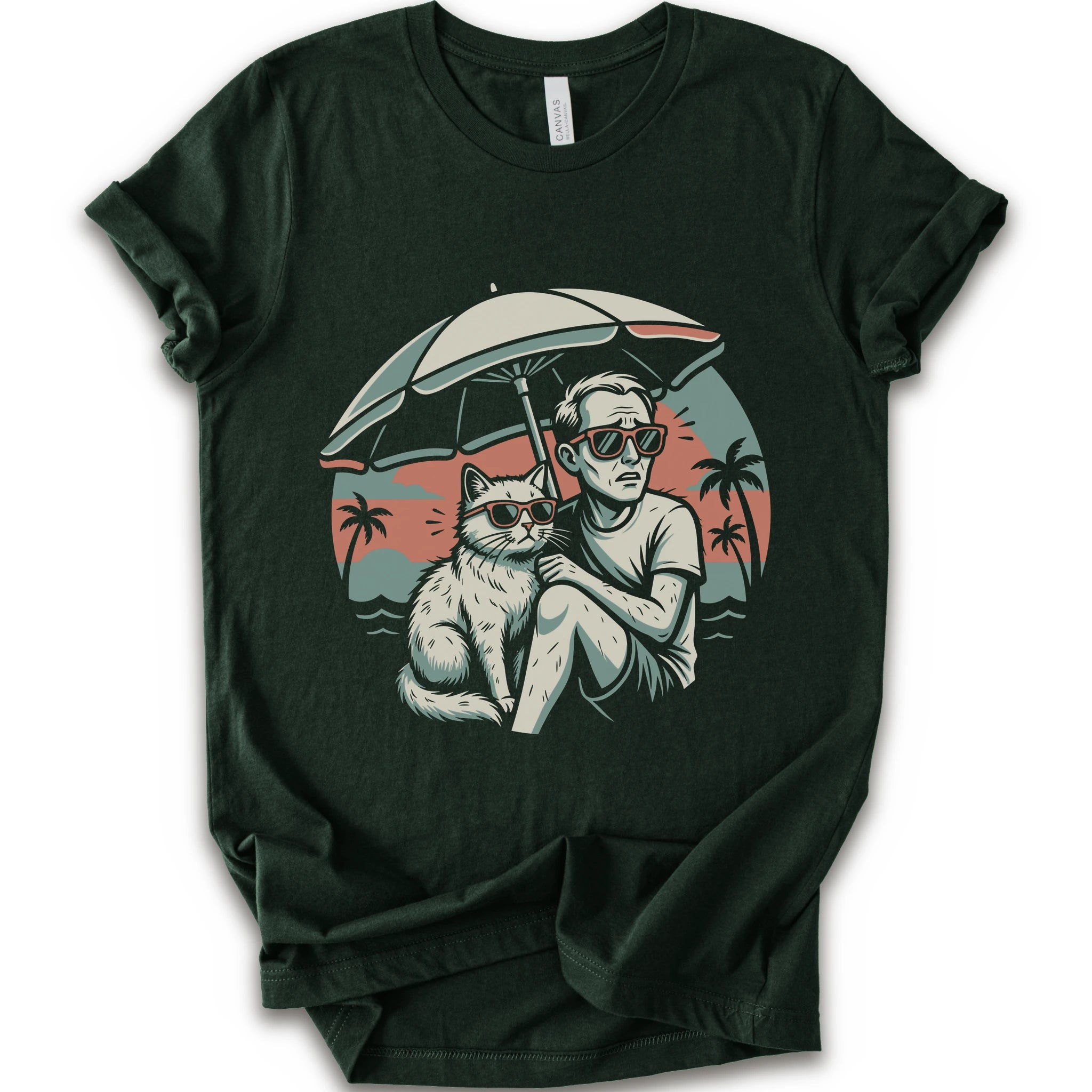 A forest short-sleeve crewneck t-shirt with a vintage-style graphic print of a man and a cat sitting under a beach umbrella on a sunset beach.