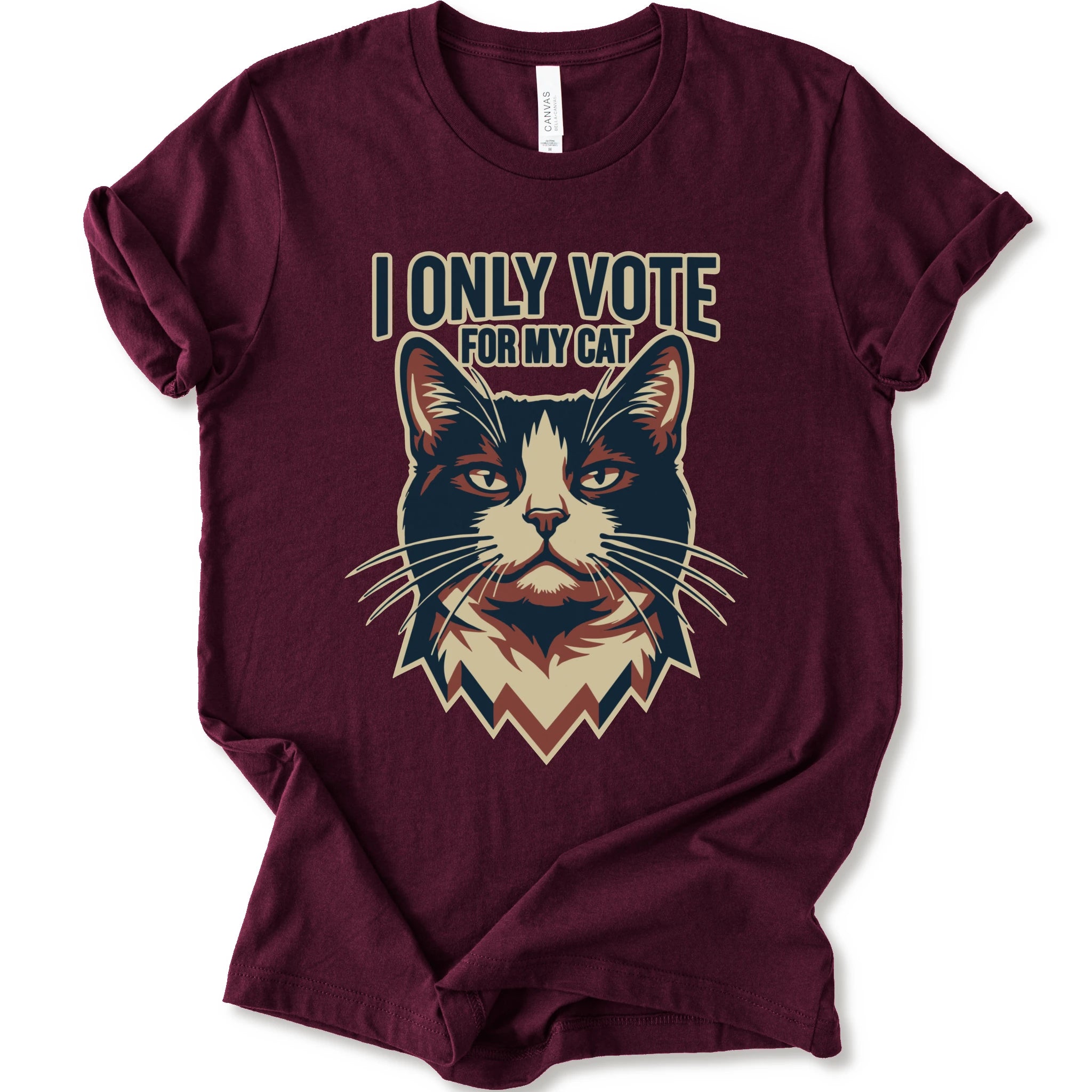 A maroon short-sleeve t-shirt with a graphic print of a cat's face and the text 'I ONLY VOTE FOR MY CAT' in a stylized font.