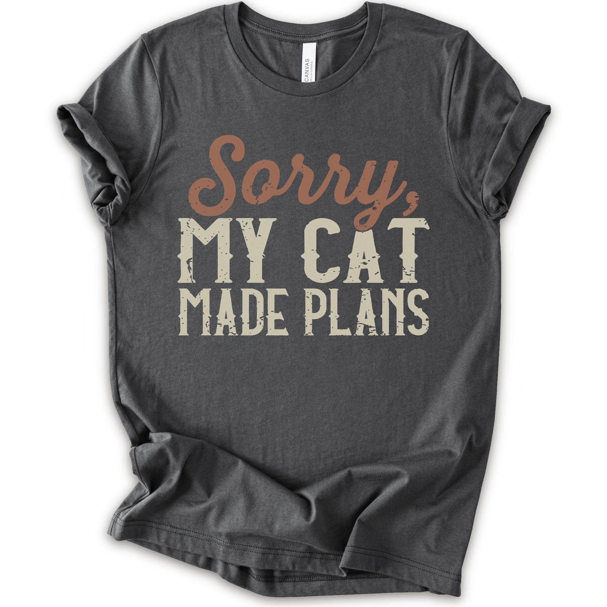 A asphalt short-sleeve crewneck t-shirt with a distressed graphic print that reads 'Sorry, MY CAT MADE PLANS' in brown and off-white lettering