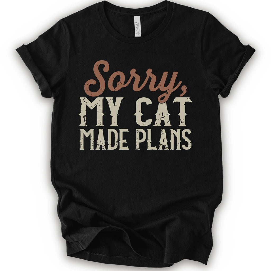 A black short-sleeve crewneck t-shirt with a distressed graphic print that reads 'Sorry, MY CAT MADE PLANS' in brown and off-white lettering