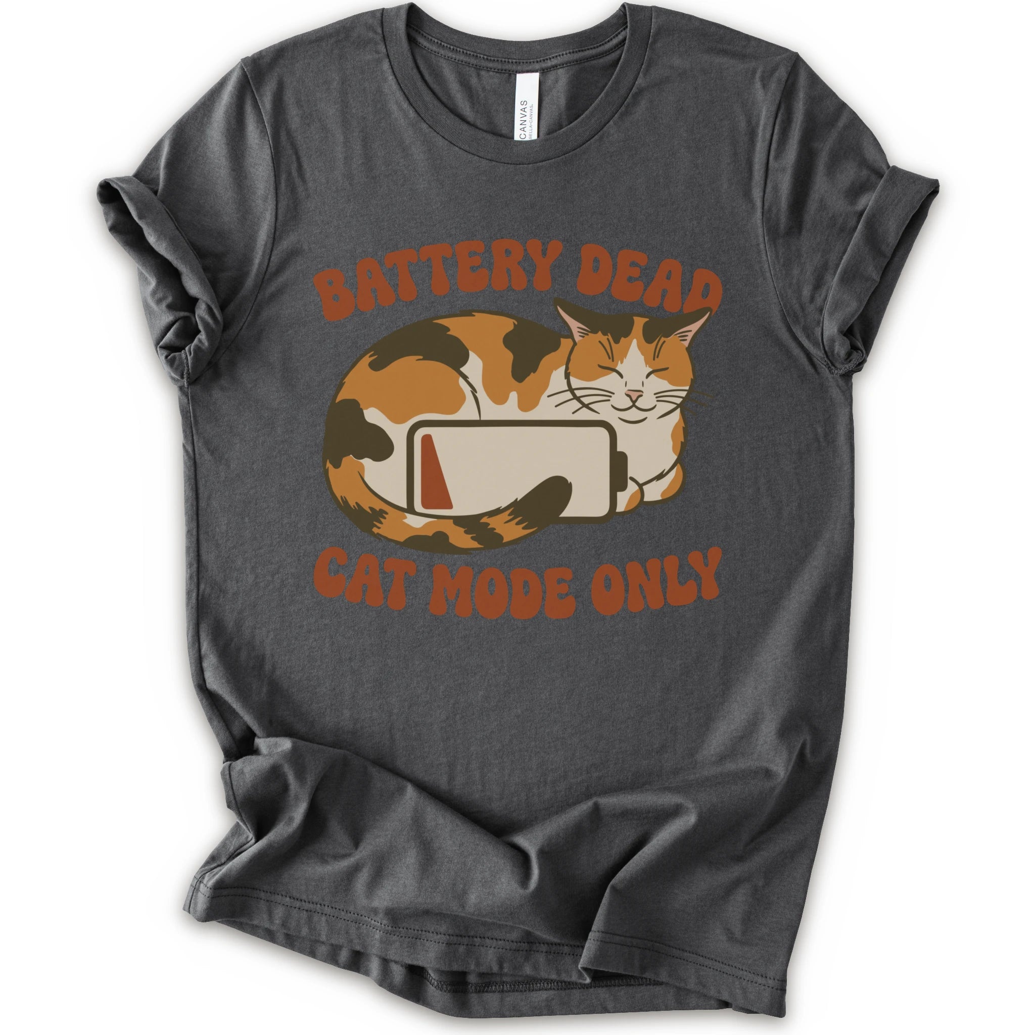A asphalt short-sleeve graphic t-shirt featuring a cartoon calico cat curled up around a battery icon, with the text 'BATTERY DEAD CAT MODE ONLY' in orange-brown lettering.