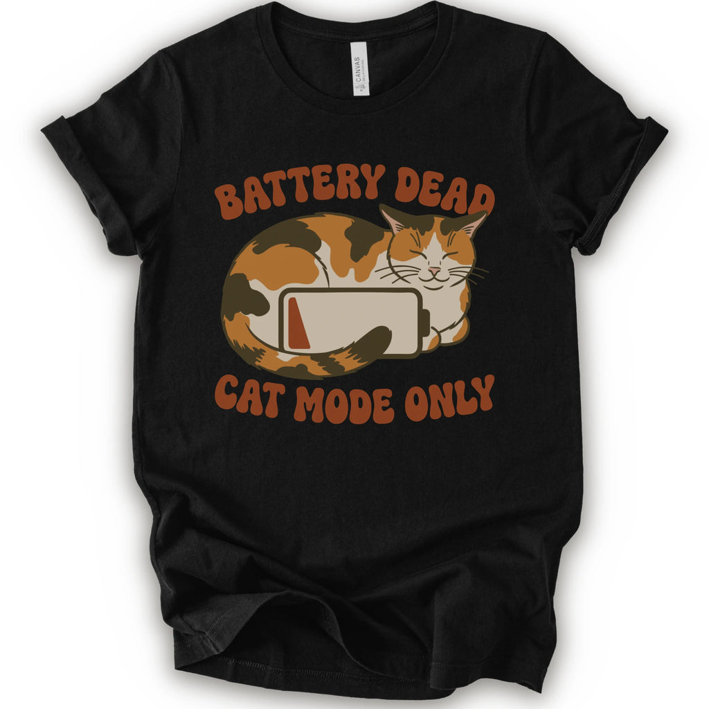 A black short-sleeve graphic t-shirt featuring a cartoon calico cat curled up around a battery icon, with the text 'BATTERY DEAD CAT MODE ONLY' in orange-brown lettering.