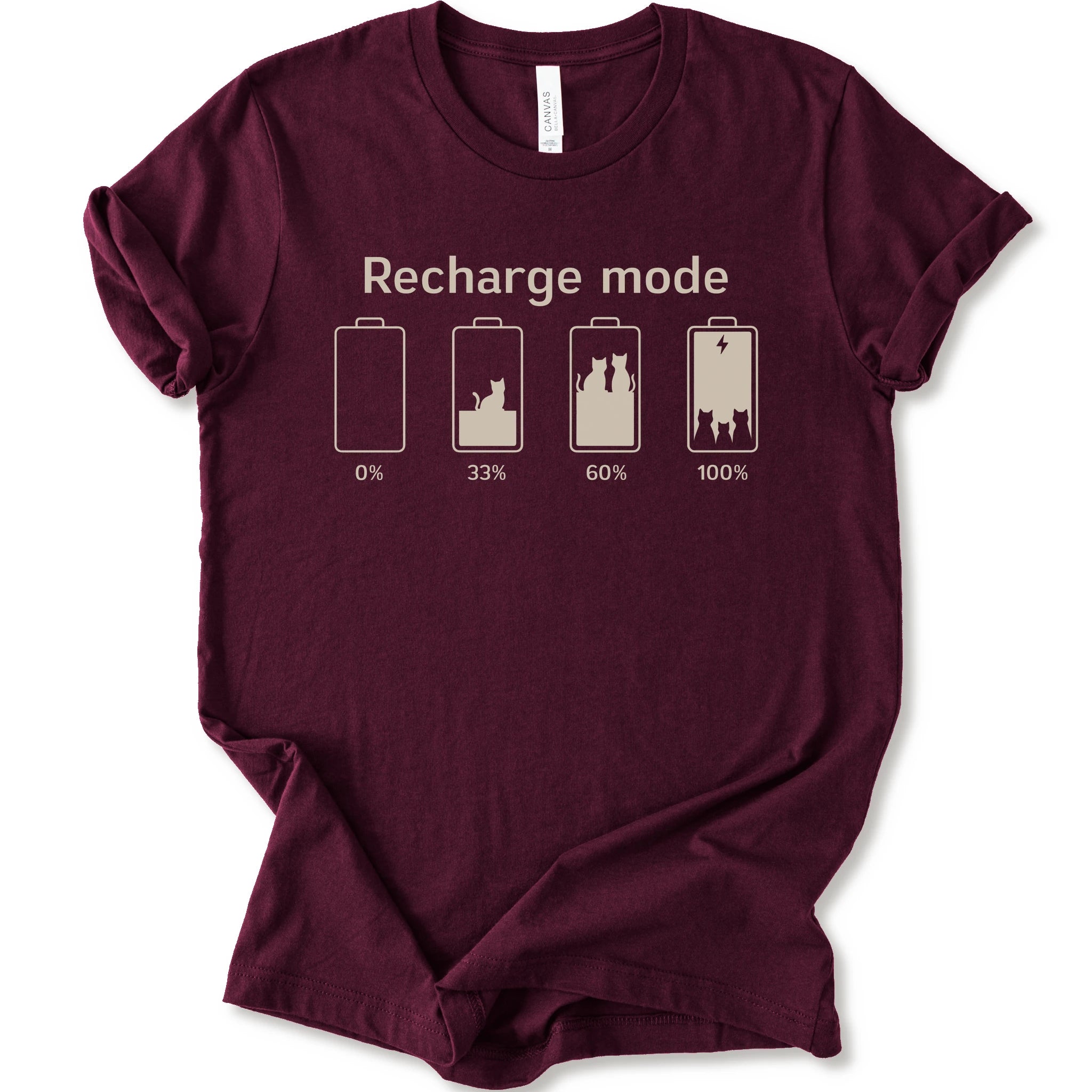 A maroon short-sleeve crewneck t-shirt with a graphic print on the front. The graphic features the text 'Recharge mode' above four battery icons showing battery levels from 0% to 100% with a cat silhouette inside the batteries.