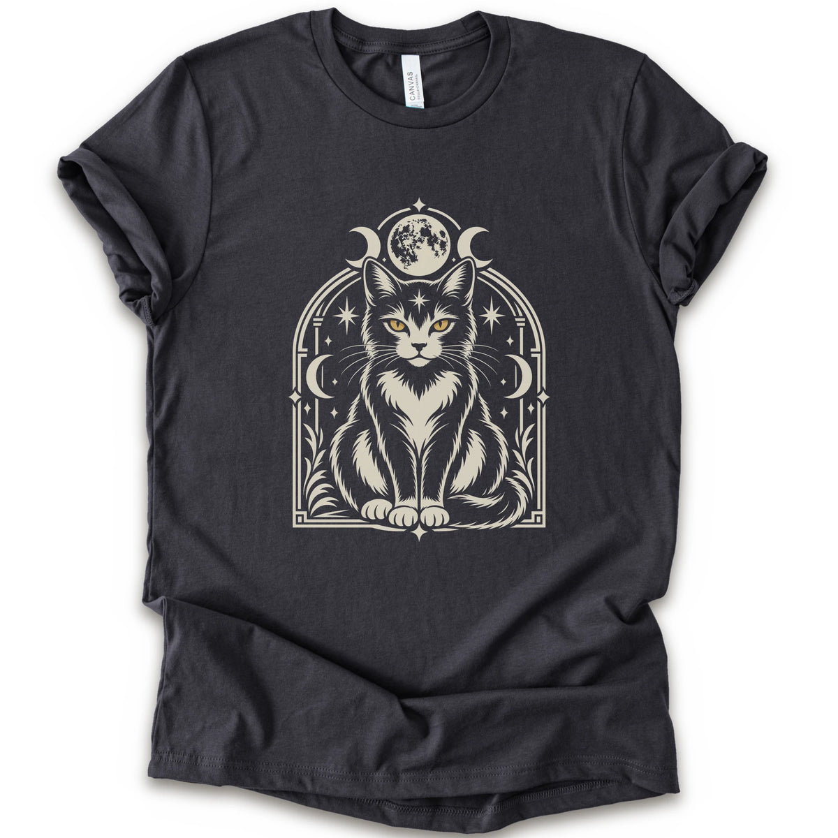 A dark grey short-sleeve crewneck t-shirt featuring a detailed graphic of a black and white cat with yellow eyes, framed by crescent moons and stars.