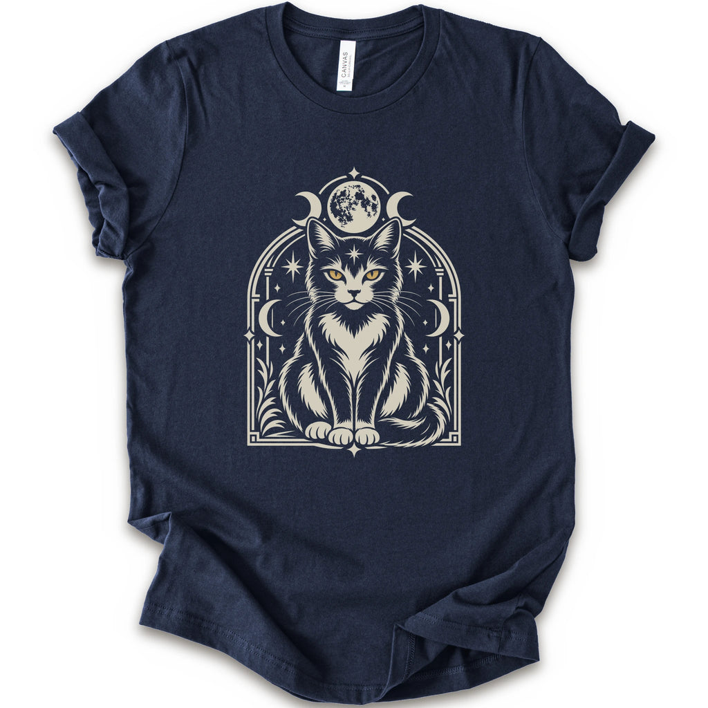 A navy short-sleeve crewneck t-shirt featuring a detailed graphic of a black and white cat with yellow eyes, framed by crescent moons and stars.