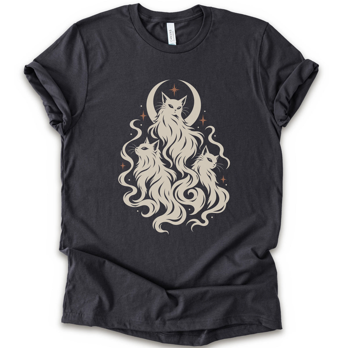 A dark grey short-sleeve crewneck t-shirt featuring a cream-colored graphic of three cats with long flowing hair in front of a crescent moon and stars.
