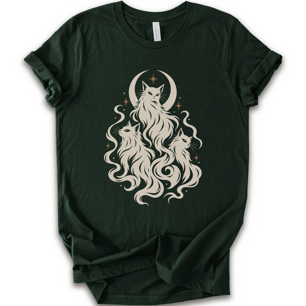 A forest short-sleeve crewneck t-shirt featuring a cream-colored graphic of three cats with long flowing hair in front of a crescent moon and stars.