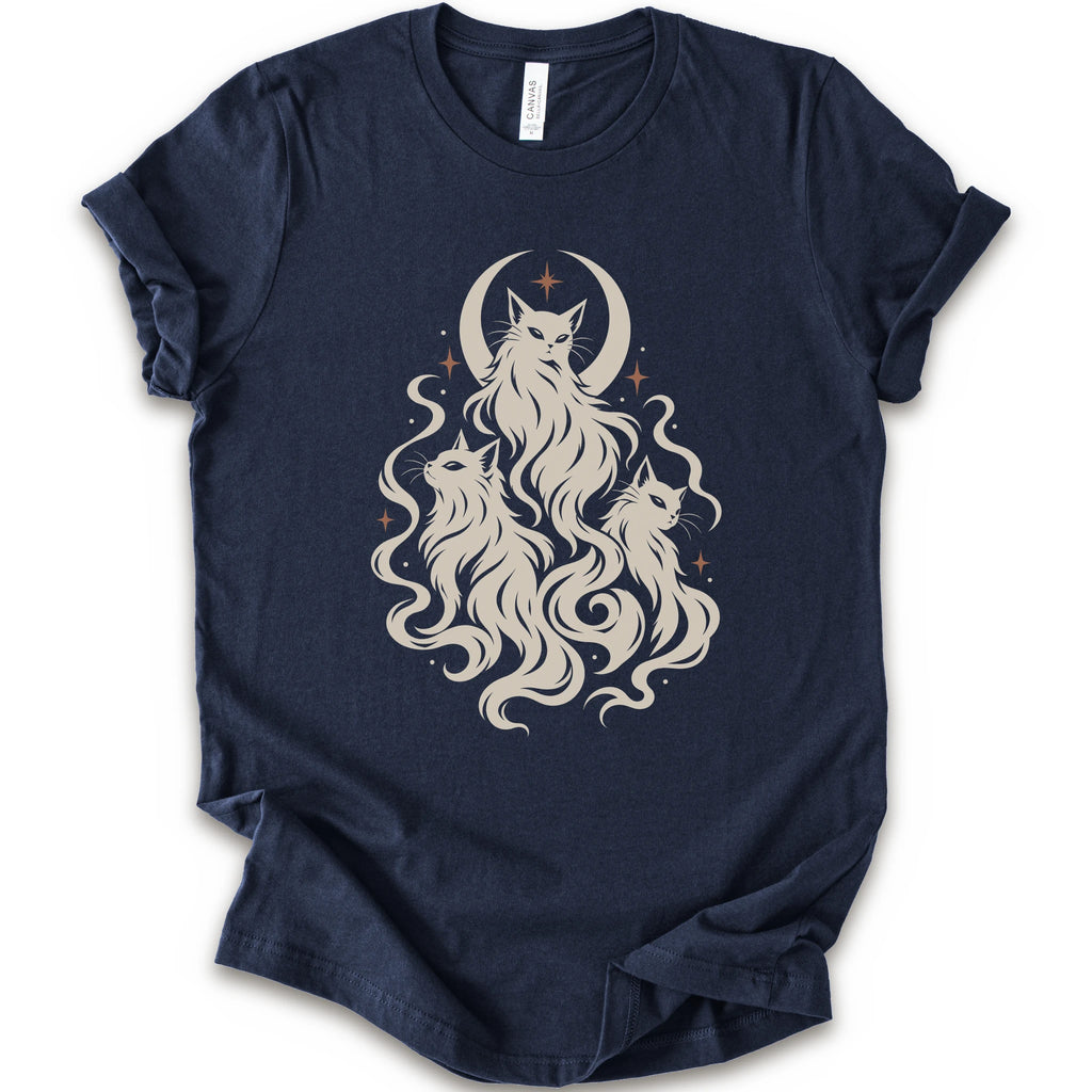 A navy short-sleeve crewneck t-shirt featuring a cream-colored graphic of three cats with long flowing hair in front of a crescent moon and stars.