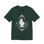 A forest short-sleeve crewneck t-shirt featuring a graphic with white Sphynx cat with moon phases, crystals, peonies and geometric diamond line art