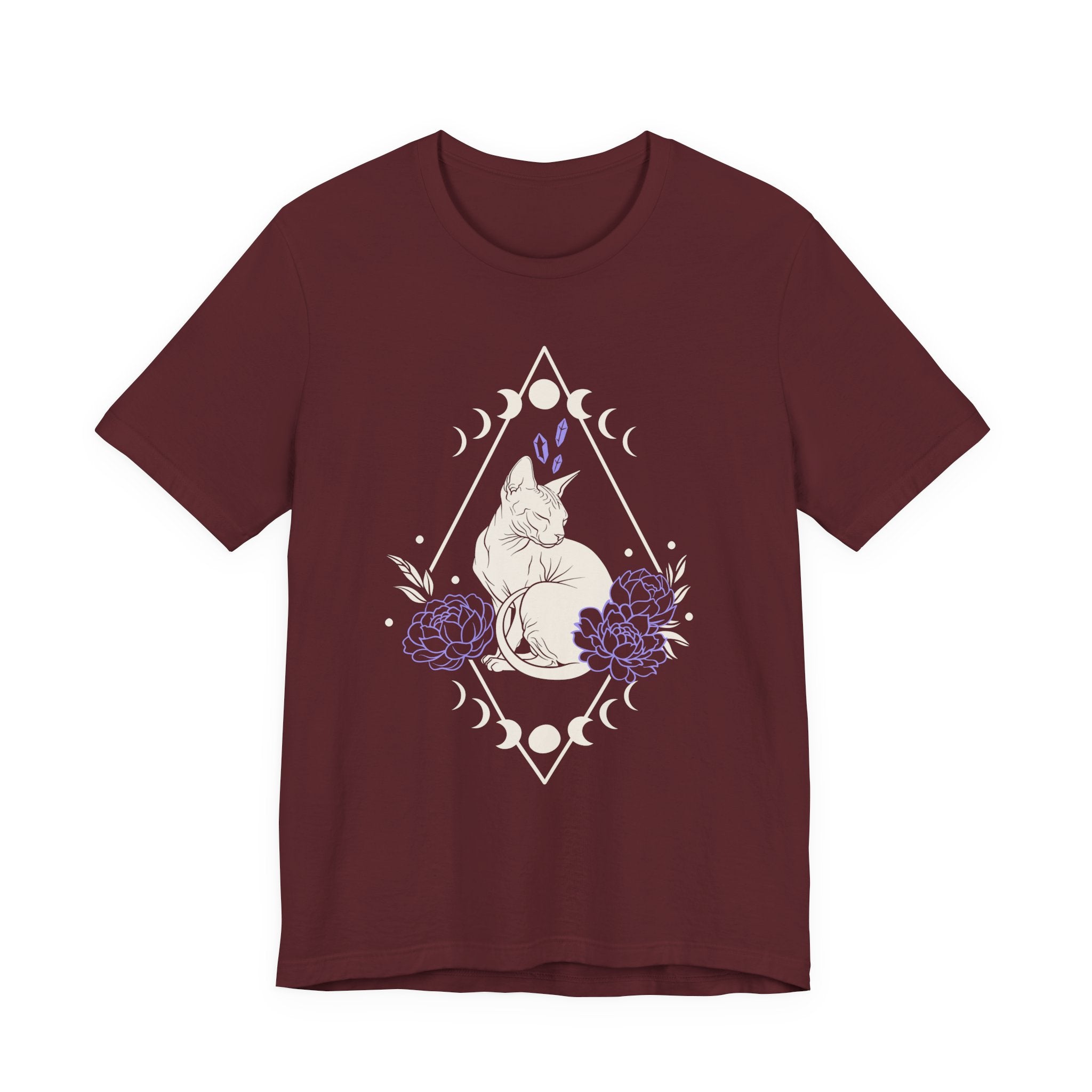 A maroon short-sleeve crewneck t-shirt featuring a graphic with white Sphynx cat with moon phases, crystals, peonies and geometric diamond line art
