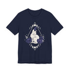 A navy short-sleeve crewneck t-shirt featuring a graphic with white Sphynx cat with moon phases, crystals, peonies and geometric diamond line art