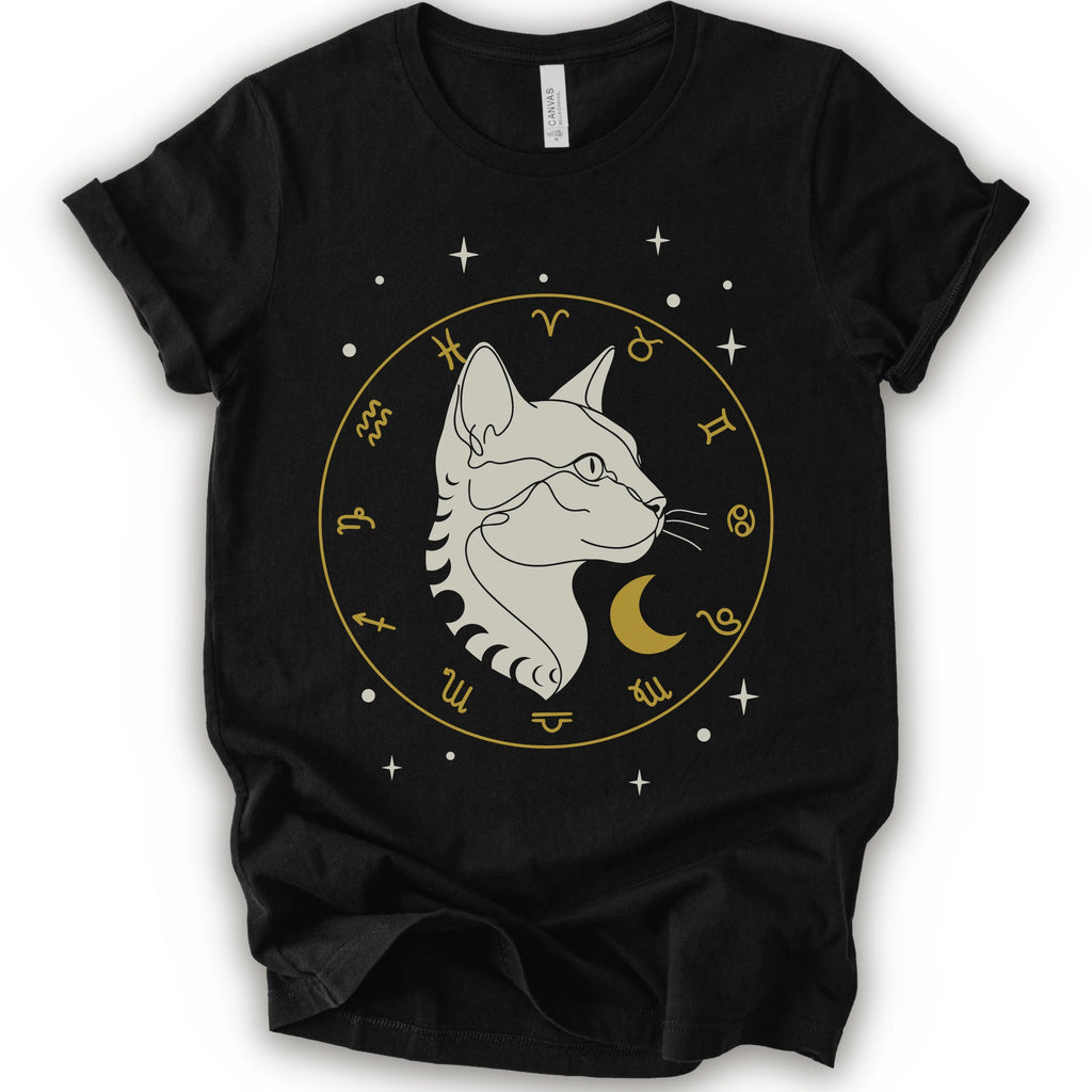A black short-sleeve crewneck t-shirt featuring a graphic of a white cat profile inside a gold zodiac wheel with a crescent moon and stars.