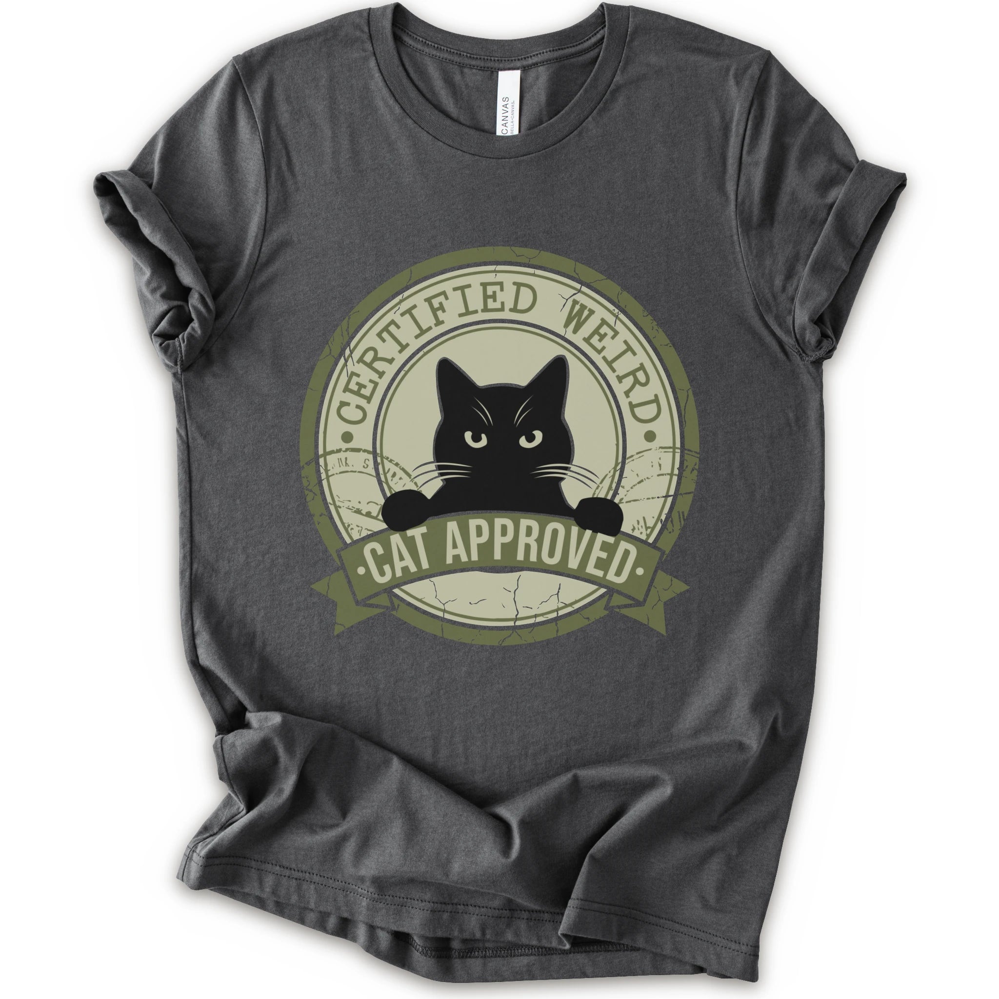 A asphalt short-sleeve crewneck t-shirt with a vintage-style circular graphic on the front. The graphic features a black cat peeking out from inside a distressed olive green circle with a banner reading 'CERTIFIED WEIRD - CAT APPROVED'.