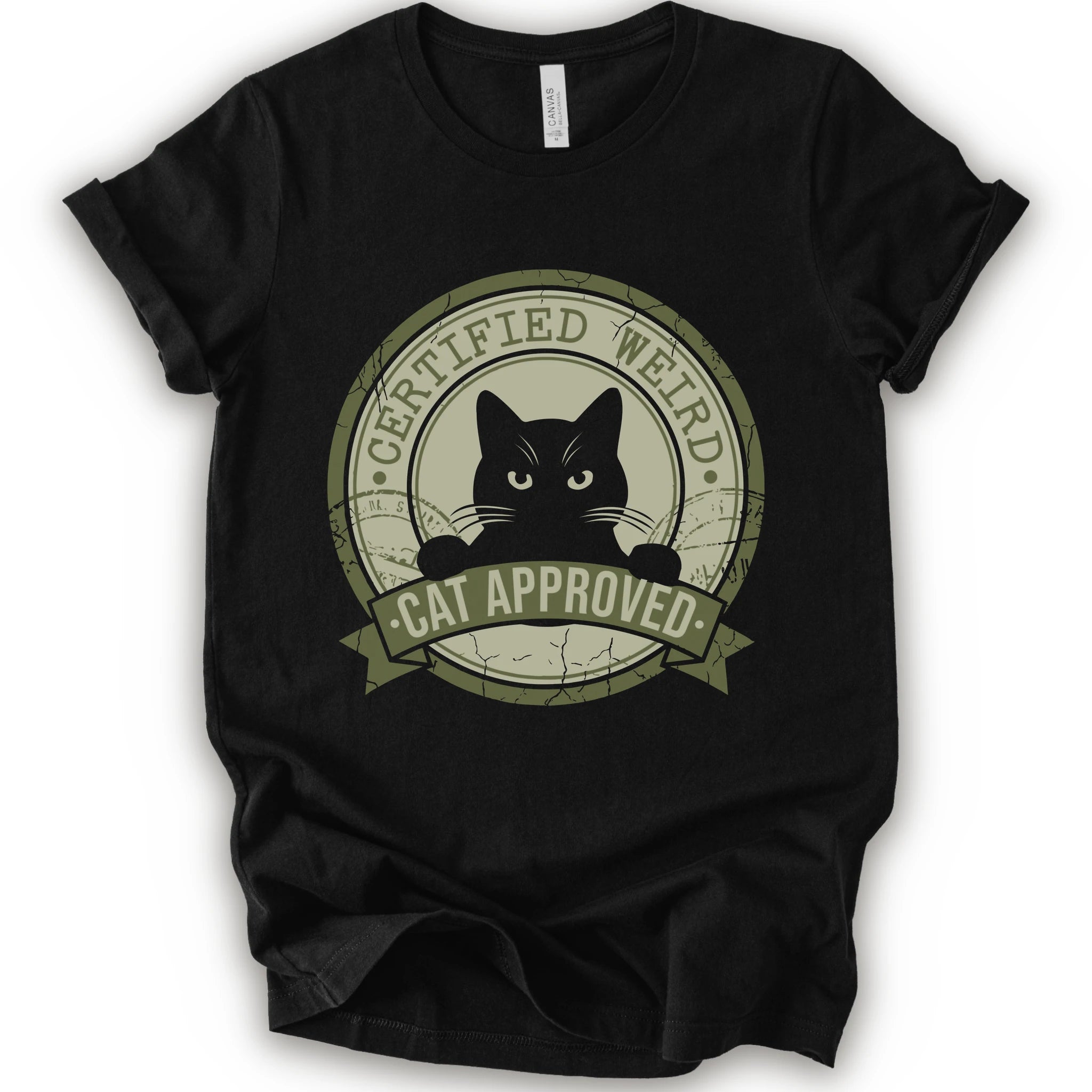 A black short-sleeve crewneck t-shirt with a vintage-style circular graphic on the front. The graphic features a black cat peeking out from inside a distressed olive green circle with a banner reading 'CERTIFIED WEIRD - CAT APPROVED'.