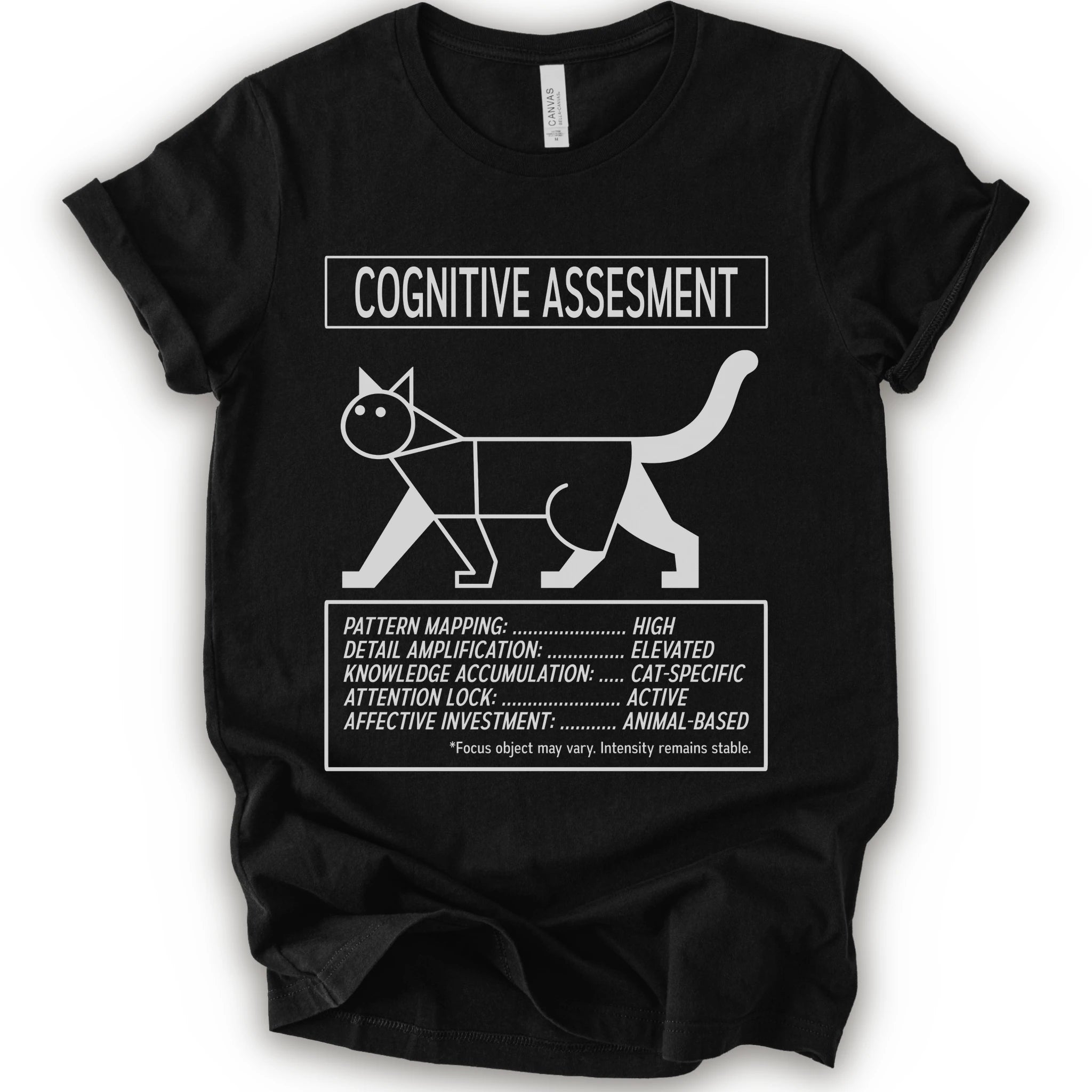 A black short-sleeve t-shirt with a white graphic print titled 'COGNITIVE ASSESSMENT' featuring a minimalist line drawing of a cat and a checklist-style design.