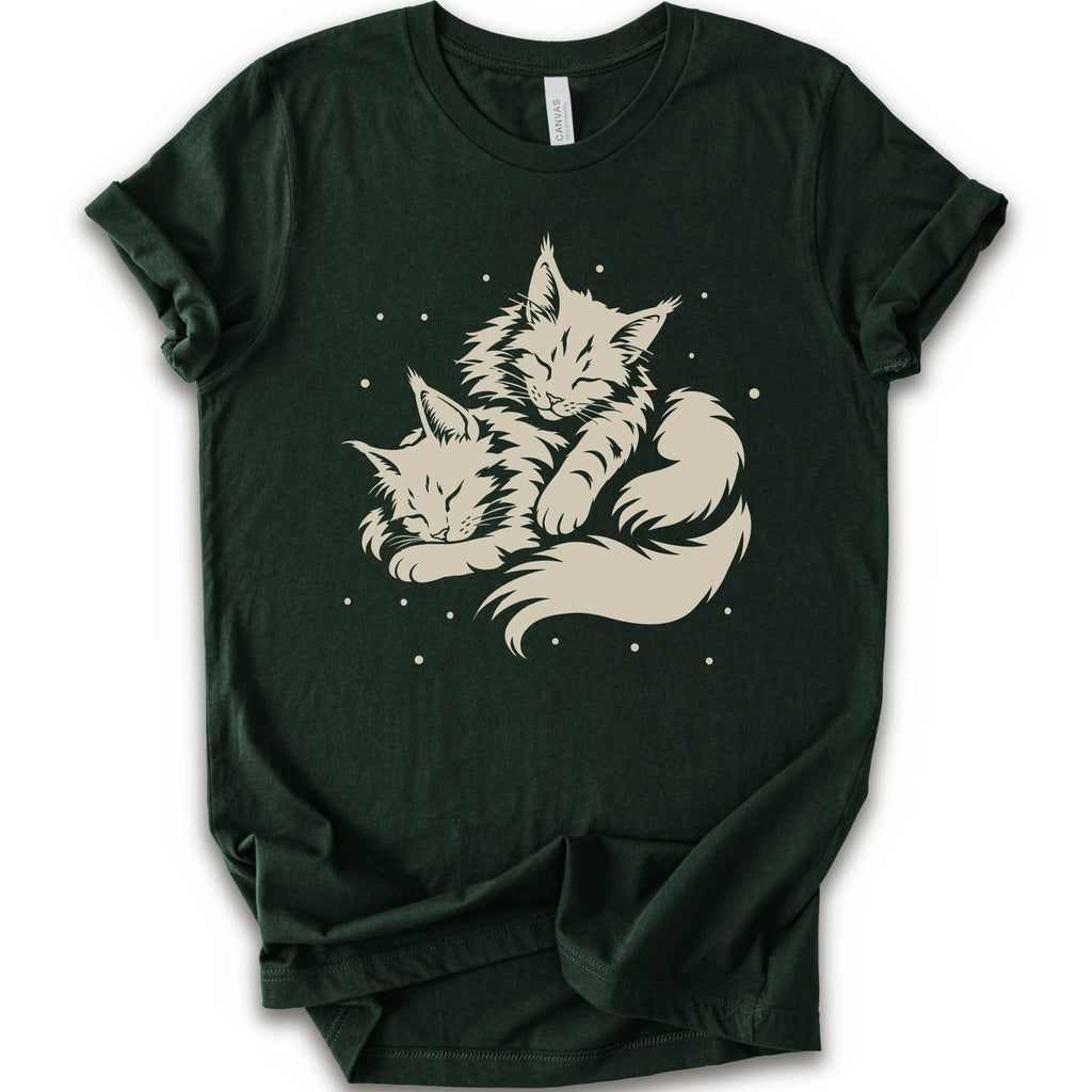 A forest short-sleeve crewneck t-shirt featuring a cream-colored graphic of two sleeping fluffy kittens nestled together on a white background.