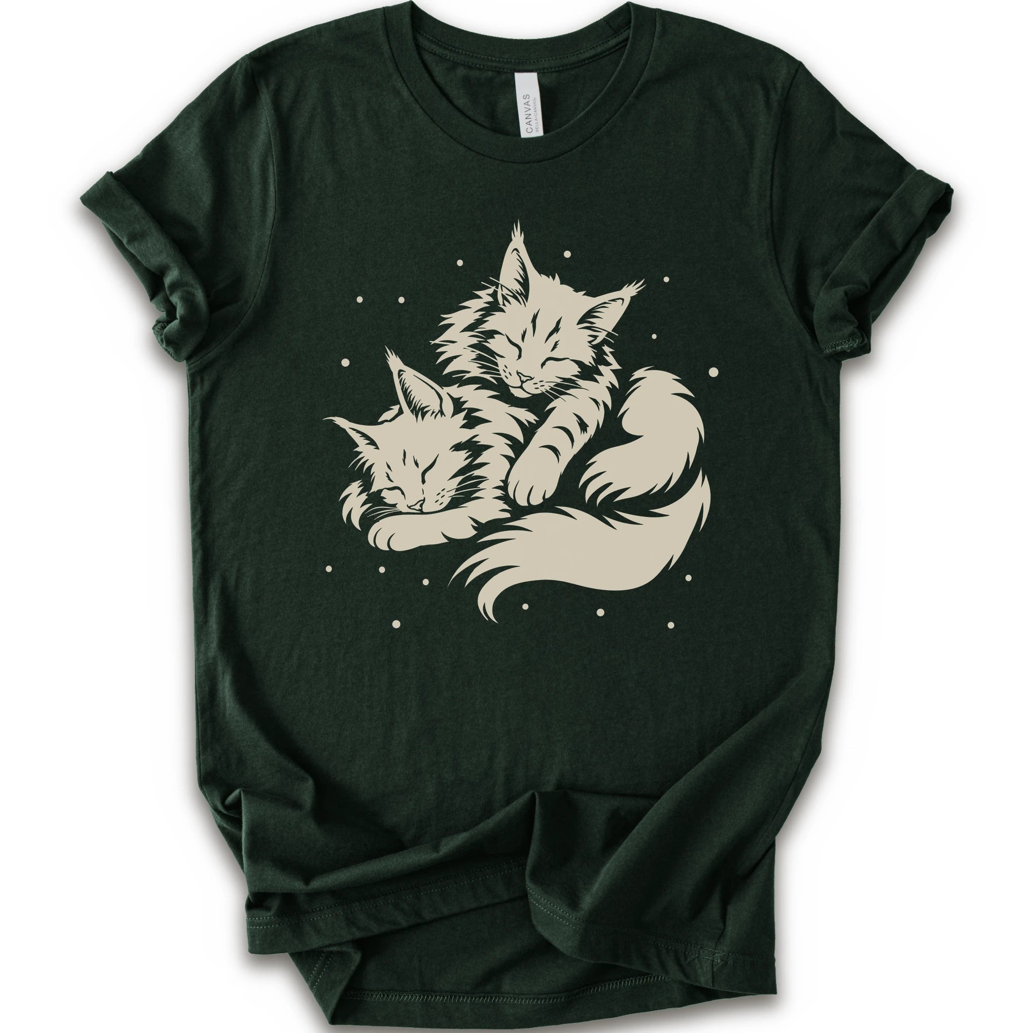 A forest short-sleeve crewneck t-shirt featuring a cream-colored graphic of two sleeping fluffy kittens nestled together on a white background.