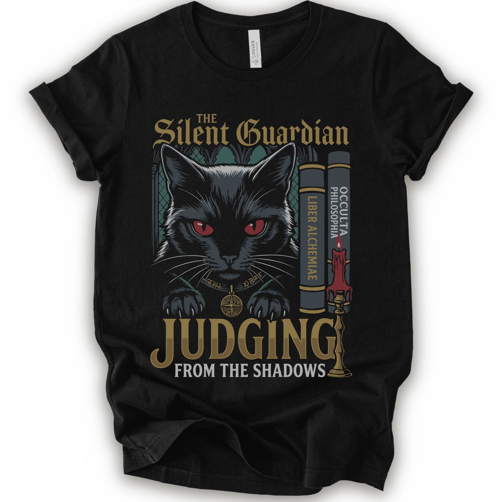 A black short-sleeve graphic t-shirt featuring a stylized illustration of a black cat with red eyes, gold gothic text reading 'The Silent Guardian Judging from the Shadows,' and decorative book and candle motifs on the front.