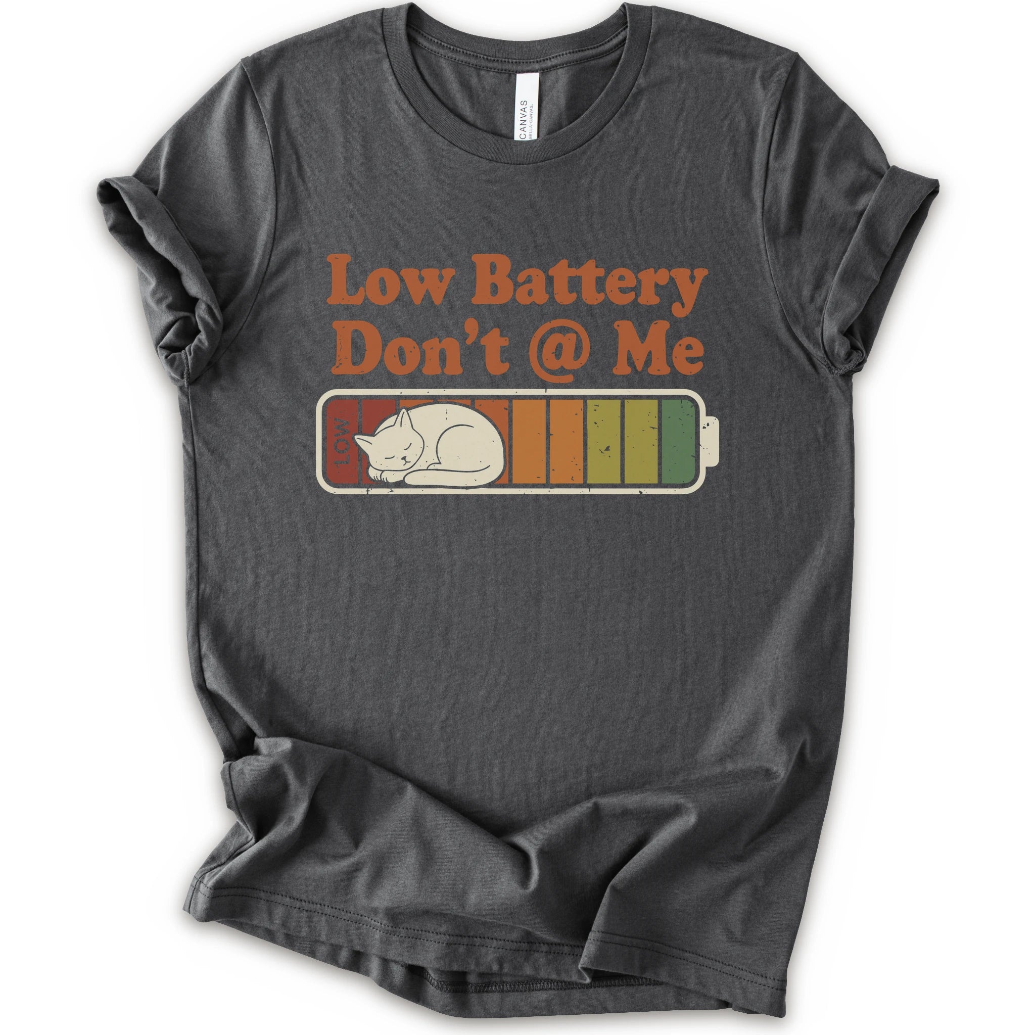 An asphalt short-sleeve t-shirt with a graphic print that reads 'Low Battery Don't @ Me' above a retro battery icon containing a sleeping cat.