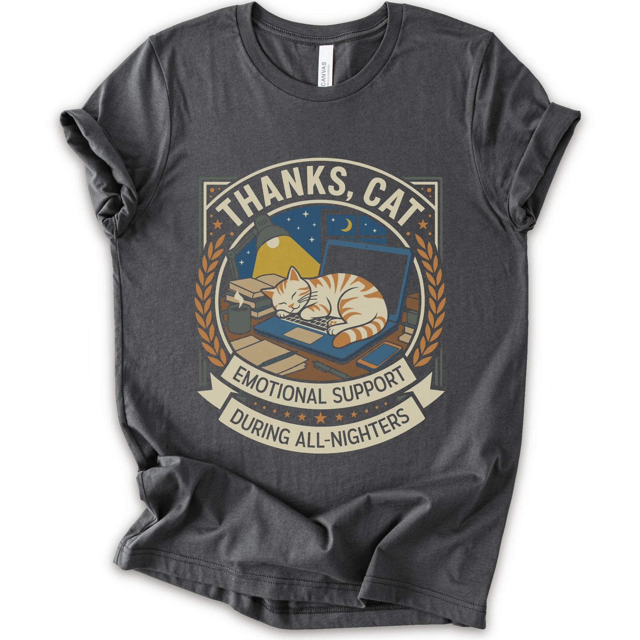 A asphalt short-sleeve crewneck t-shirt with a vintage-style graphic on the front. The graphic features an orange tabby cat sleeping on a blue laptop under a night sky, framed by the text 'THANKS, CAT' and 'EMOTIONAL SUPPORT DURING ALL-NIGHTERS'.