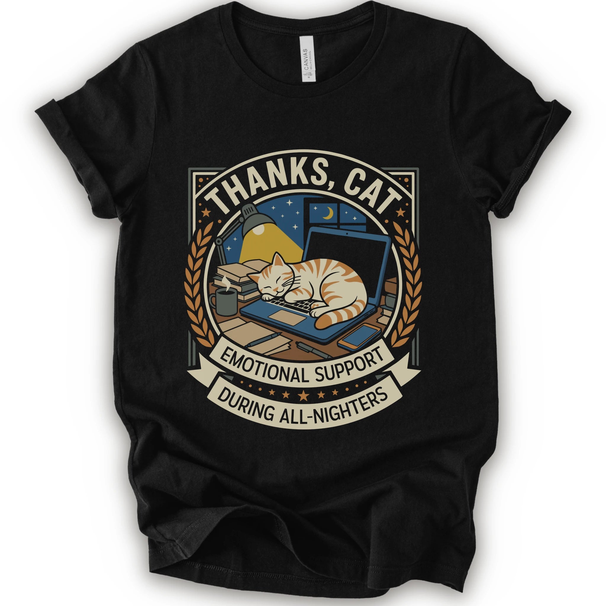 A black short-sleeve crewneck t-shirt with a vintage-style graphic on the front. The graphic features an orange tabby cat sleeping on a blue laptop under a night sky, framed by the text 'THANKS, CAT' and 'EMOTIONAL SUPPORT DURING ALL-NIGHTERS'.