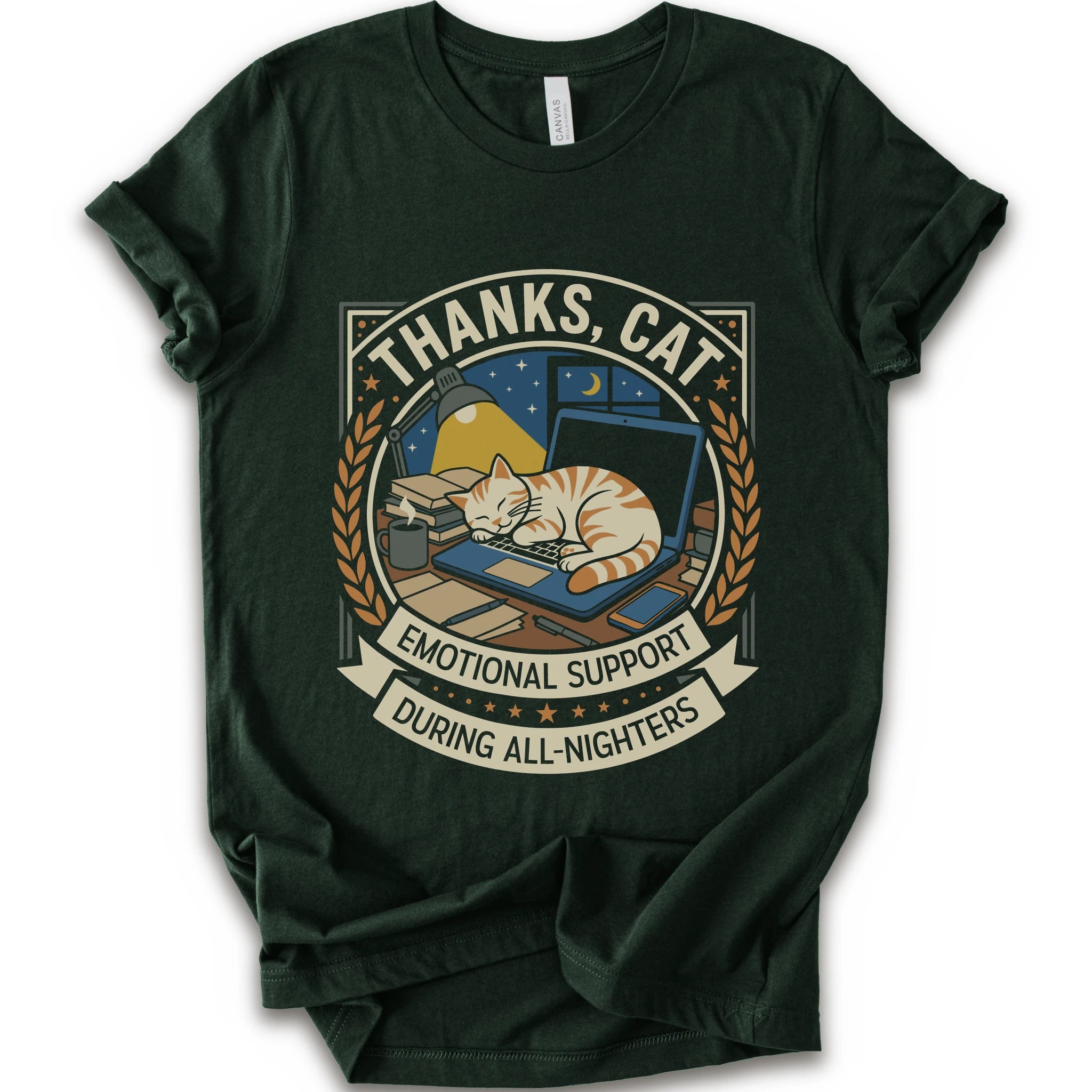 A forest short-sleeve crewneck t-shirt with a vintage-style graphic on the front. The graphic features an orange tabby cat sleeping on a blue laptop under a night sky, framed by the text 'THANKS, CAT' and 'EMOTIONAL SUPPORT DURING ALL-NIGHTERS'.