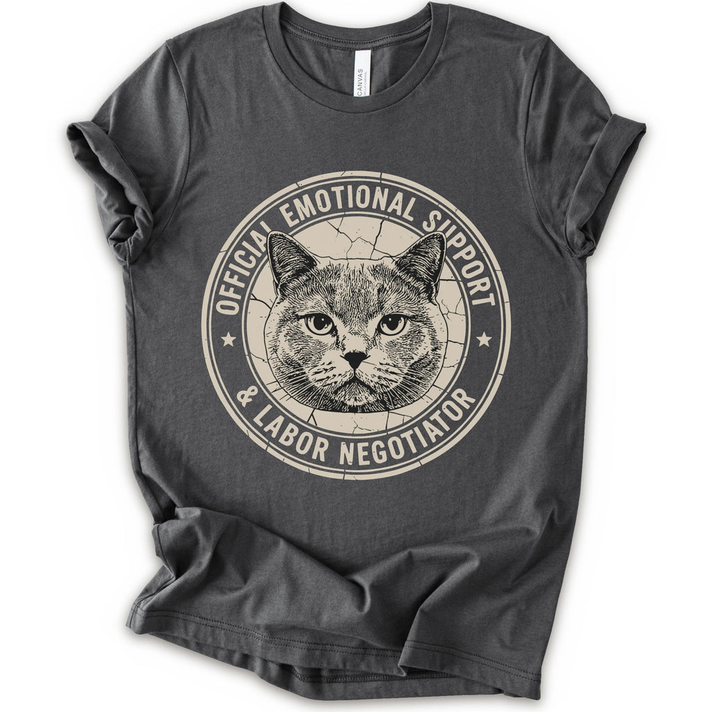 A asphalt short-sleeve crewneck t-shirt with a distressed circular graphic on the chest featuring a cat's face and the text 'OFFICIAL EMOTIONAL SUPPORT & LABOR NEGOTIATOR'.