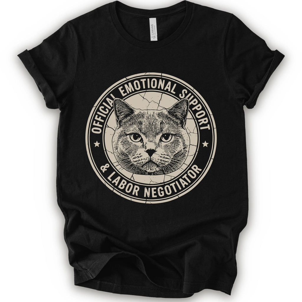 A black short-sleeve crewneck t-shirt with a distressed circular graphic on the chest featuring a cat's face and the text 'OFFICIAL EMOTIONAL SUPPORT & LABOR NEGOTIATOR'.