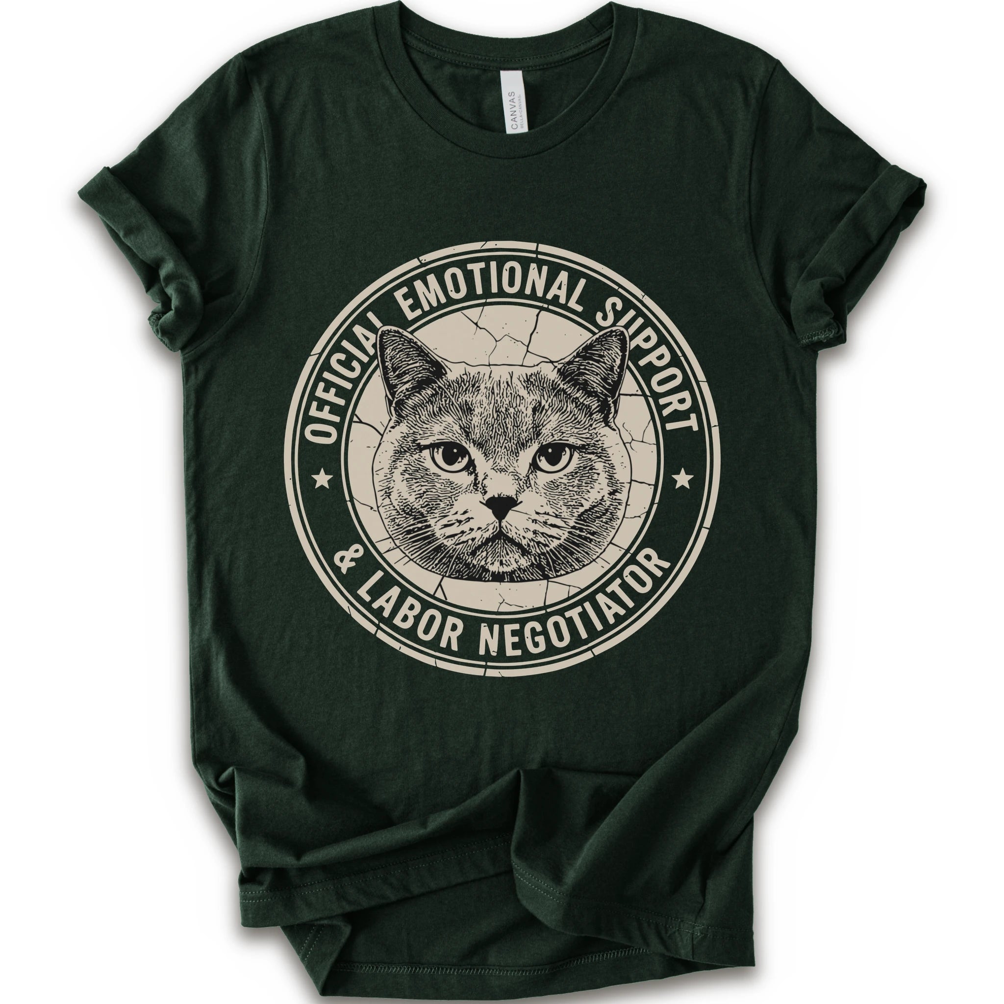 A forest short-sleeve crewneck t-shirt with a distressed circular graphic on the chest featuring a cat's face and the text 'OFFICIAL EMOTIONAL SUPPORT & LABOR NEGOTIATOR'.