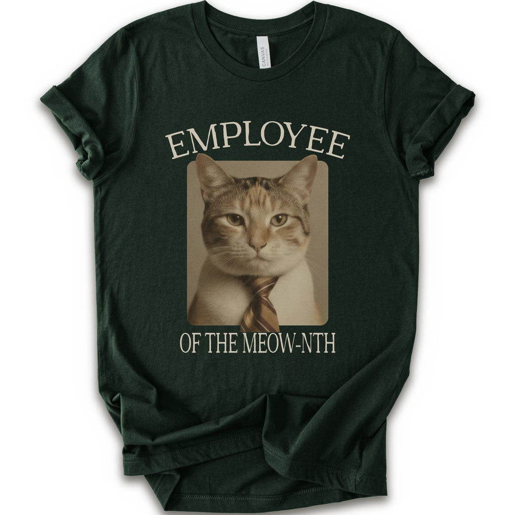A forest short-sleeve crewneck t-shirt with a graphic print of a cat wearing a tie inside a beige frame, with the text 'EMPLOYEE OF THE MEOW-NTH' in beige lettering.
