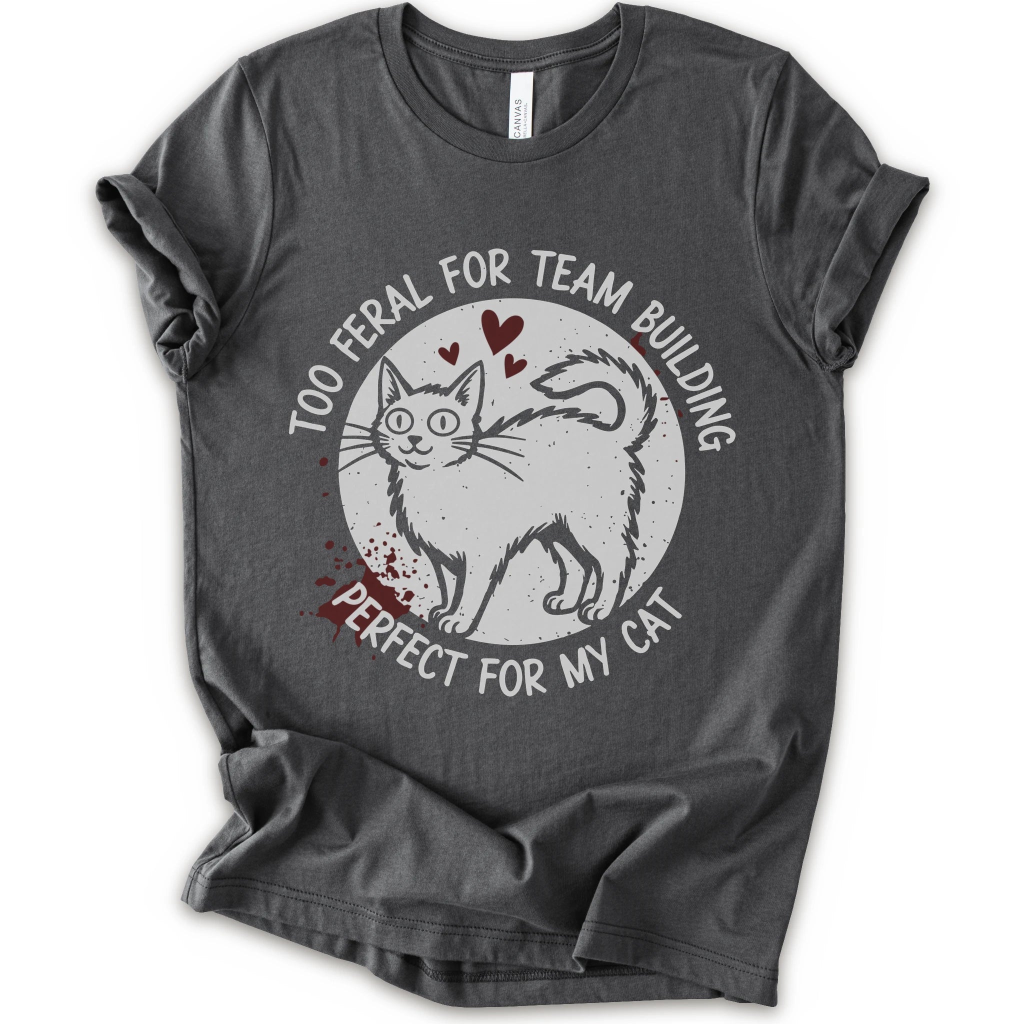 A asphalt short-sleeve crewneck t-shirt with a distressed white graphic of a cat inside a circle, surrounded by the text 'TOO FERAL FOR TEAM BUILDING' and 'PERFECT FOR MY CAT'.