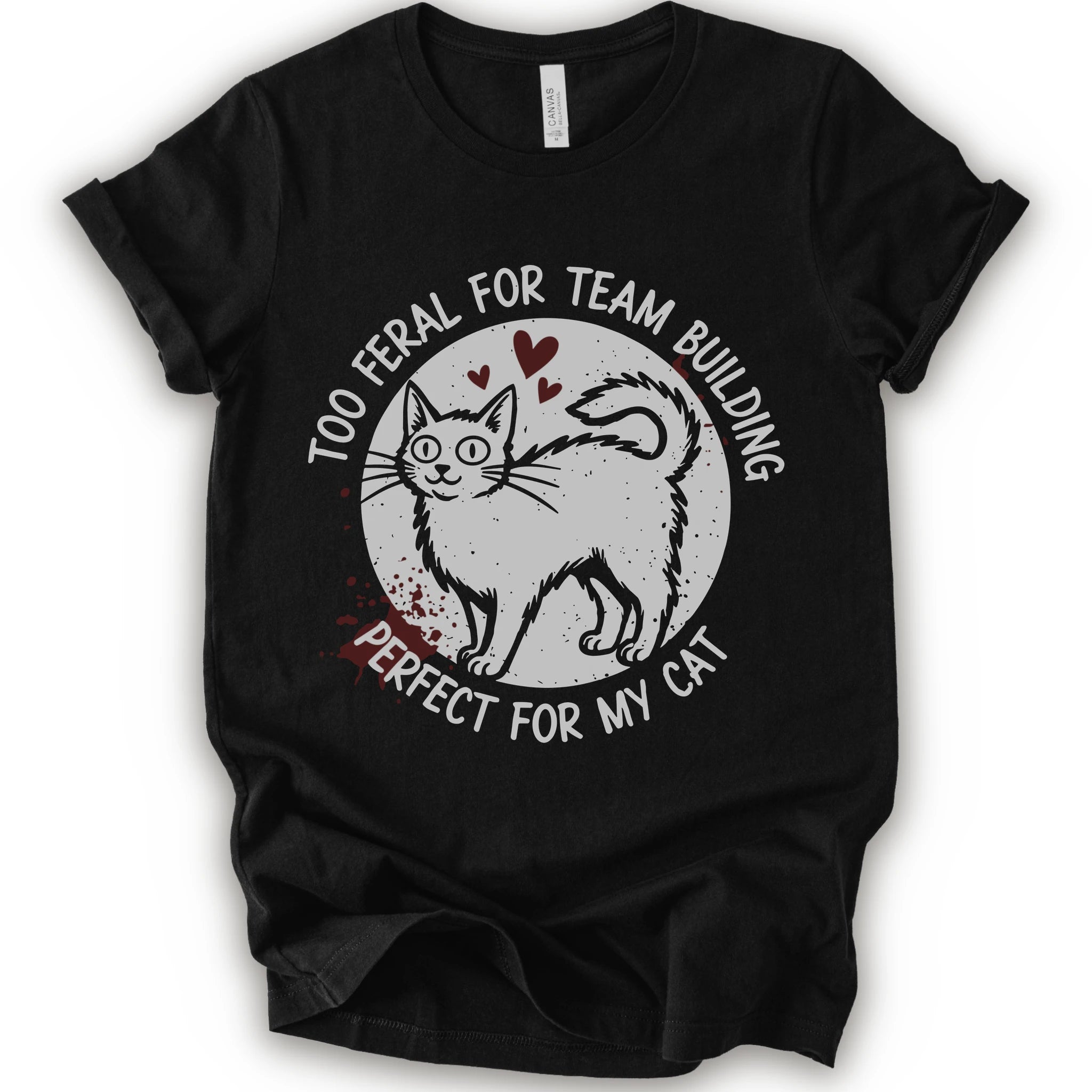 A black short-sleeve crewneck t-shirt with a distressed white graphic of a cat inside a circle, surrounded by the text 'TOO FERAL FOR TEAM BUILDING' and 'PERFECT FOR MY CAT'.