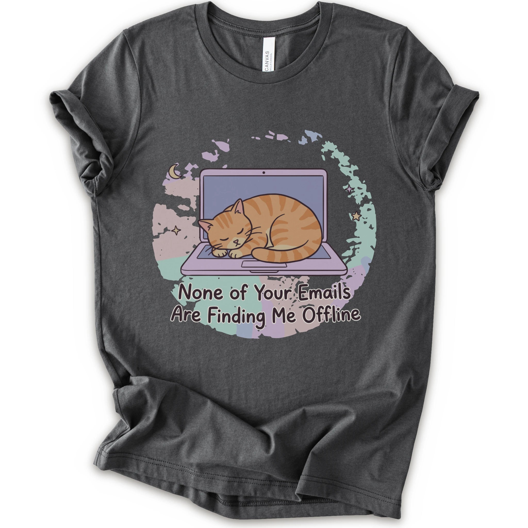 A asphalt short-sleeve graphic t-shirt featuring an illustration of an orange tabby cat sleeping on a laptop with the text 'None of Your Emails Are Finding Me Offline' underneath.