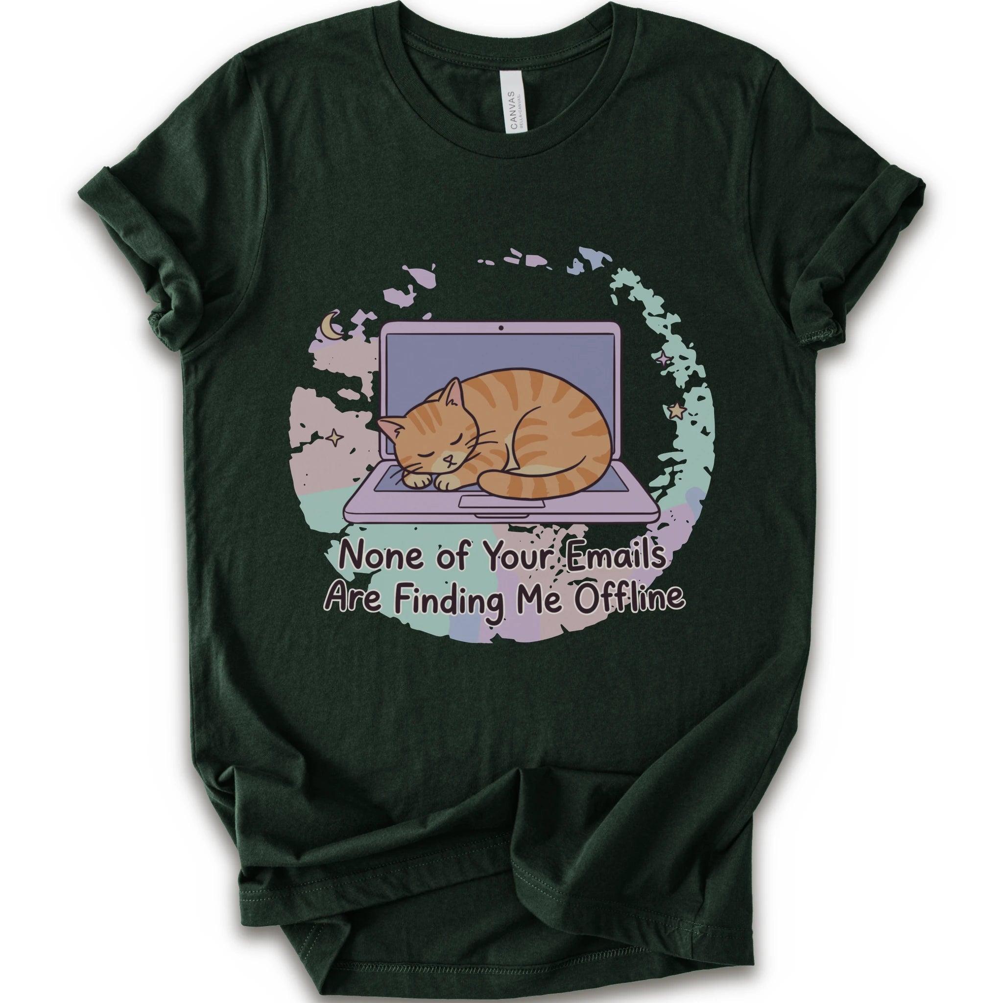 A forest short-sleeve graphic t-shirt featuring an illustration of an orange tabby cat sleeping on a laptop with the text 'None of Your Emails Are Finding Me Offline' underneath.