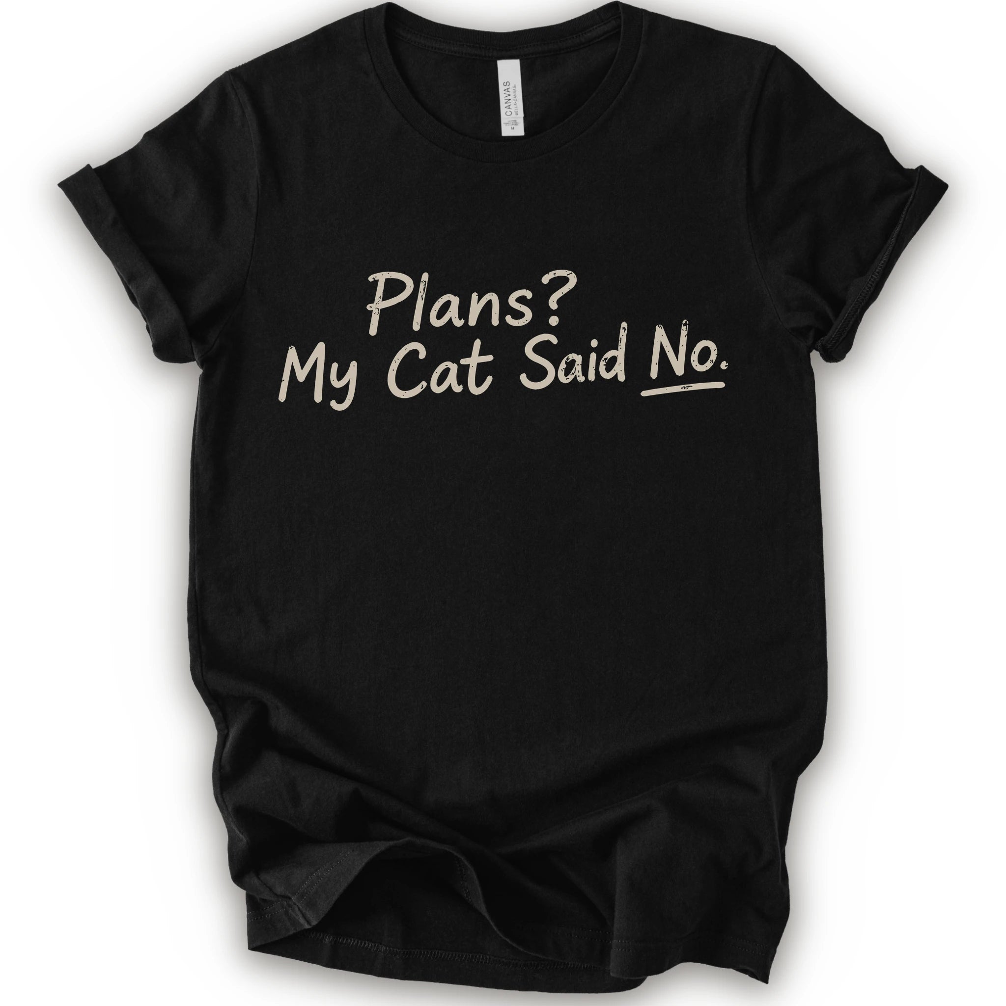 A black short-sleeve crewneck t-shirt with the phrase 'Plans? My Cat Said No.' printed in a beige handwritten font across the chest.