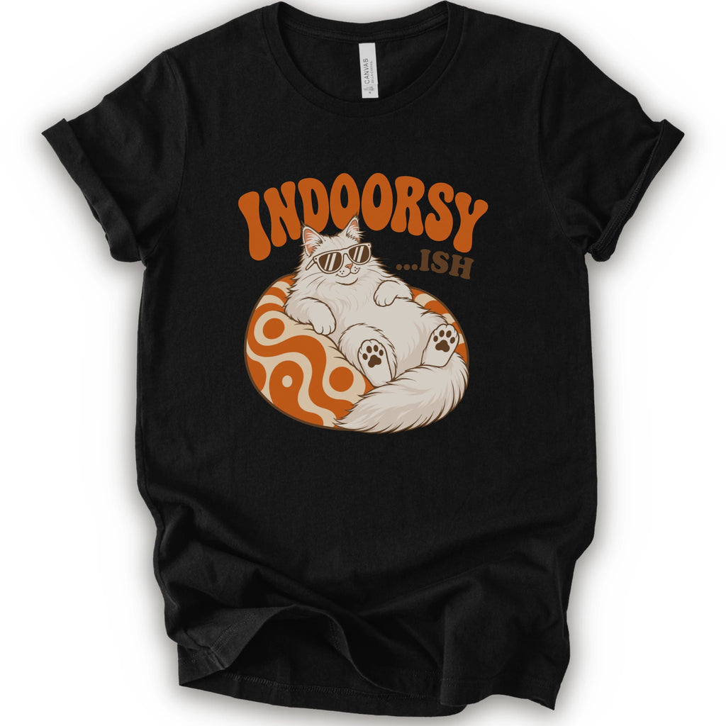 A black short-sleeve t-shirt with a graphic of a white cat wearing sunglasses on an orange patterned ball, with the text 'INDOORSY... .ish'.