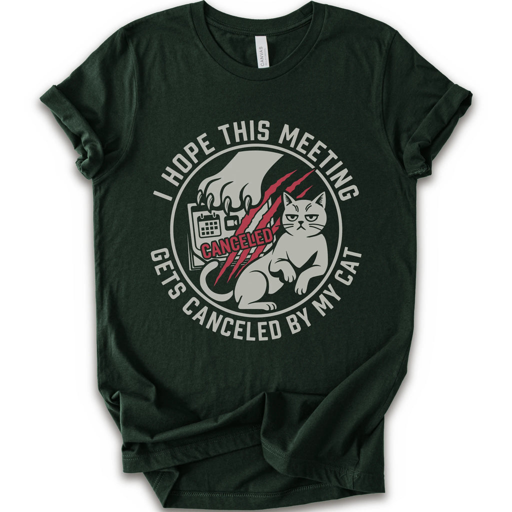 A forest short-sleeve crewneck t-shirt with a circular graphic on the front. The graphic features a white cat, a hand scratching, and the text 'I HOPE THIS MEETING GETS CANCELLED BY MY CAT' in white, with 'CANCELLED' written in red script.