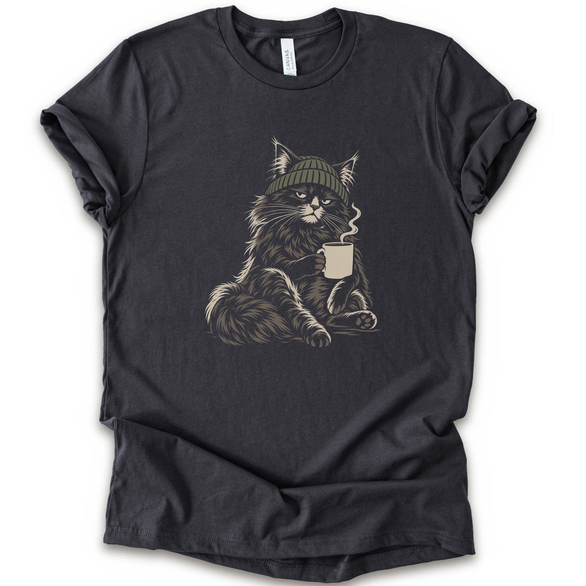A dark grey short-sleeve t-shirt with a graphic of a fluffy cat wearing a green beanie and holding a mug, displayed.