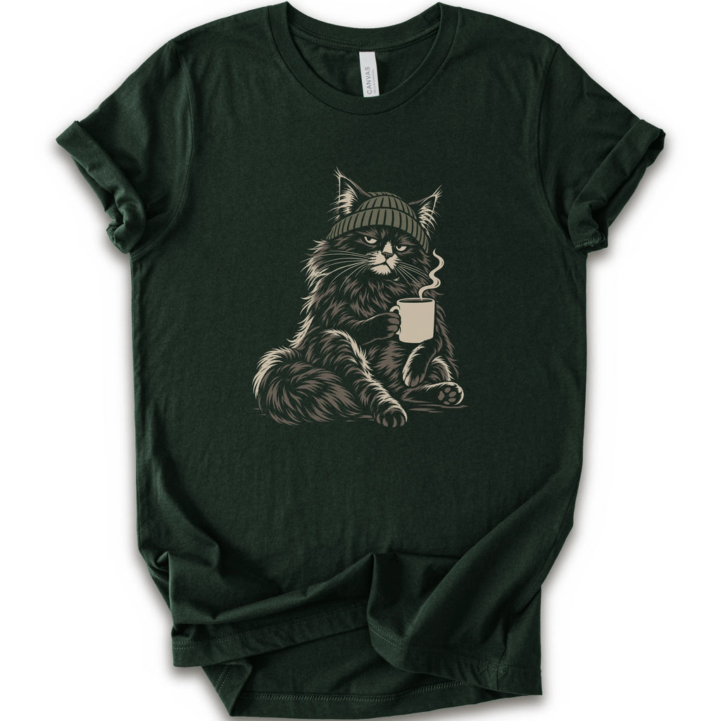 A forest short-sleeve t-shirt with a graphic of a fluffy cat wearing a green beanie and holding a mug, displayed.