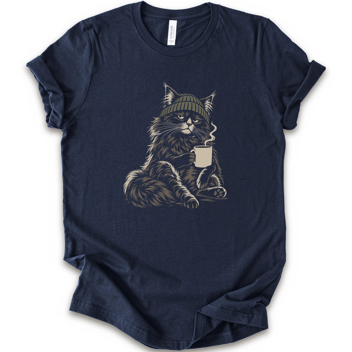 A navy short-sleeve t-shirt with a graphic of a fluffy cat wearing a green beanie and holding a mug, displayed.