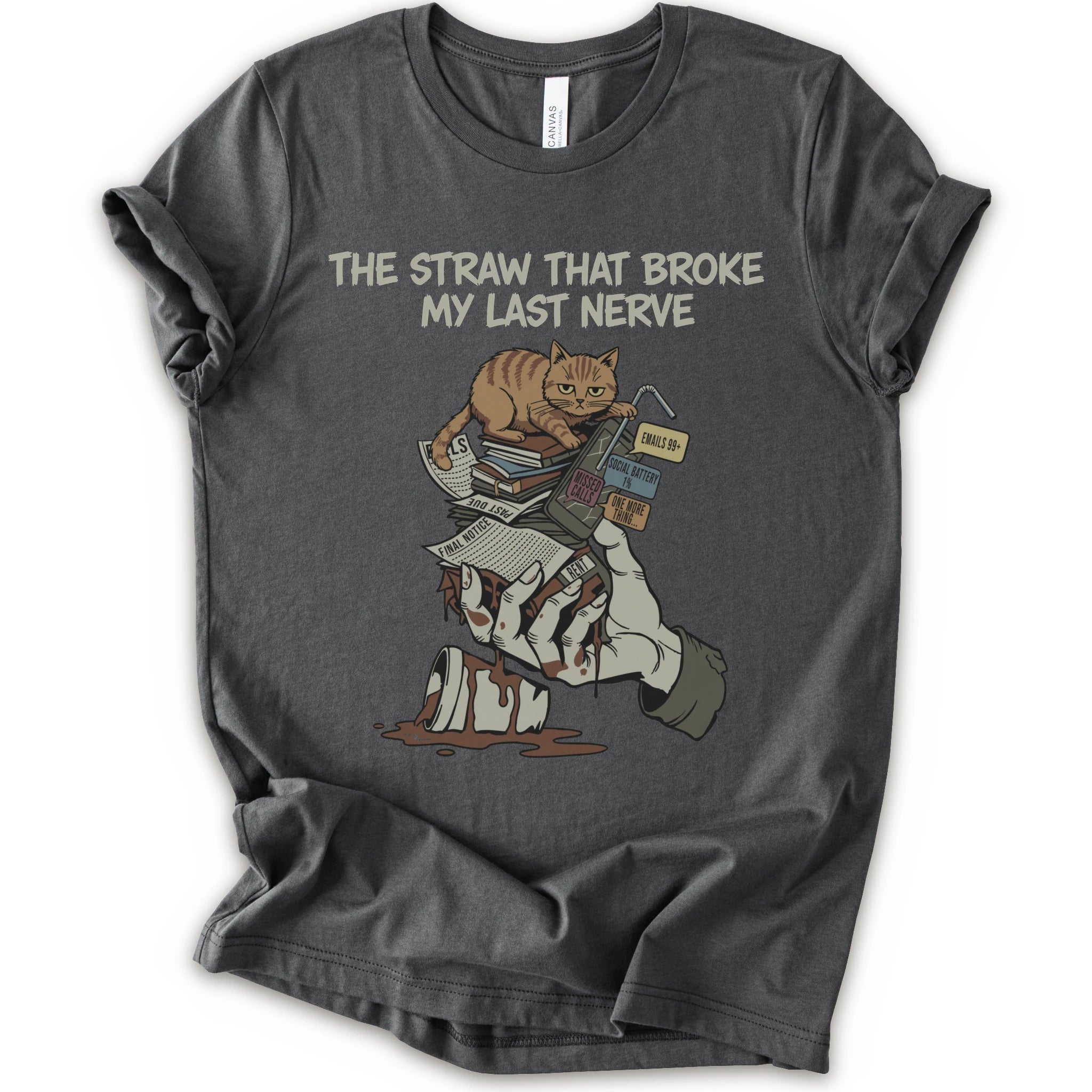 A asphalt short-sleeve graphic t-shirt featuring a cartoon illustration of an orange tabby cat sitting on books and a bloody hand holding a broken straw, with the text 'THE STRAW THAT BROKE MY LAST NERVE' printed above.