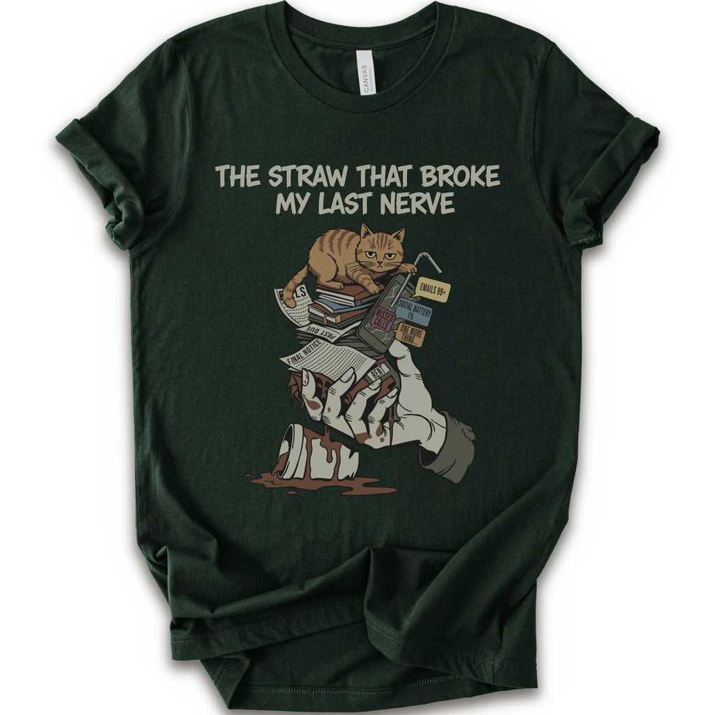 A forest short-sleeve graphic t-shirt featuring a cartoon illustration of an orange tabby cat sitting on books and a bloody hand holding a broken straw, with the text 'THE STRAW THAT BROKE MY LAST NERVE' printed above.