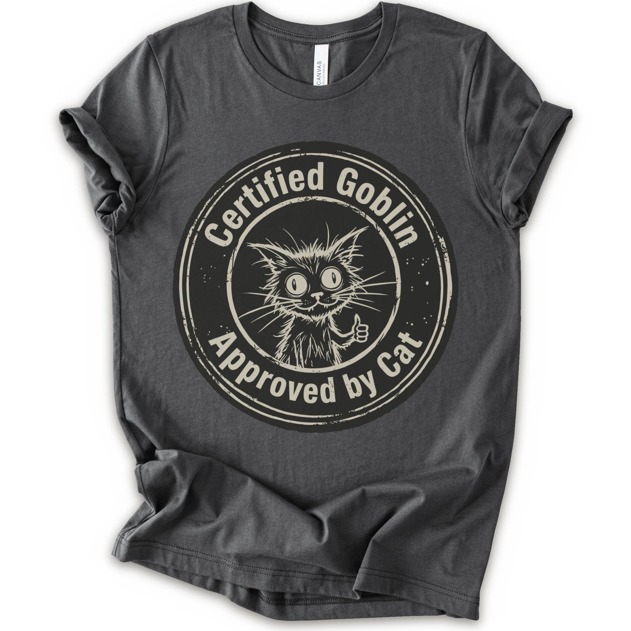 A asphalt crewneck t-shirt with a distressed beige-black circular graphic that reads 'Certified Goblin Approved by Cat' around an illustration of a cat giving a thumbs-up.
